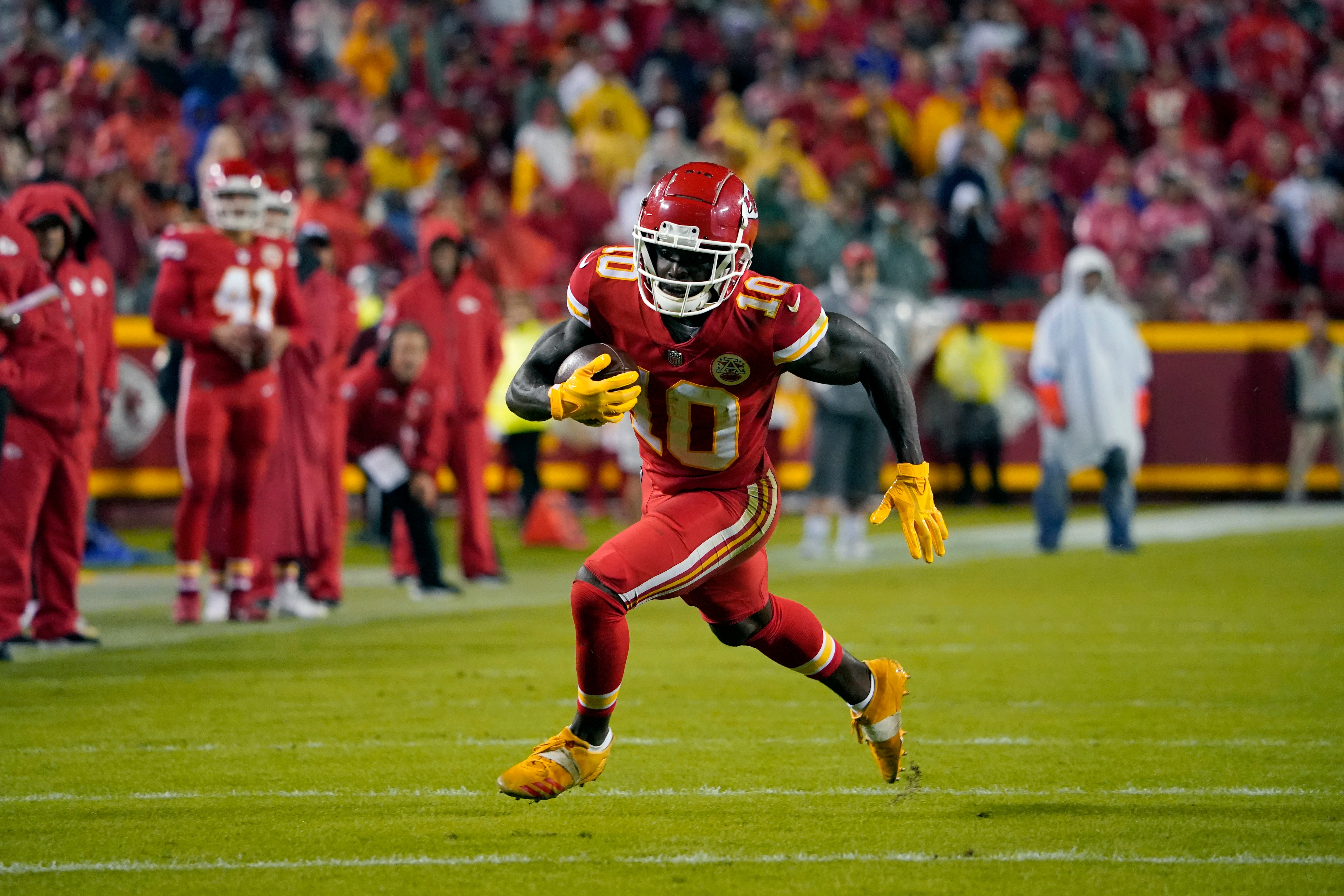 Kansas City Chiefs wide receiver Tyreek Hill runs with the ball during the second half of an NFL football game against the Buffalo Bills Sunday, Oct. 10, 2021, in Kansas City, Mo. (AP Photo/Ed Zurga)