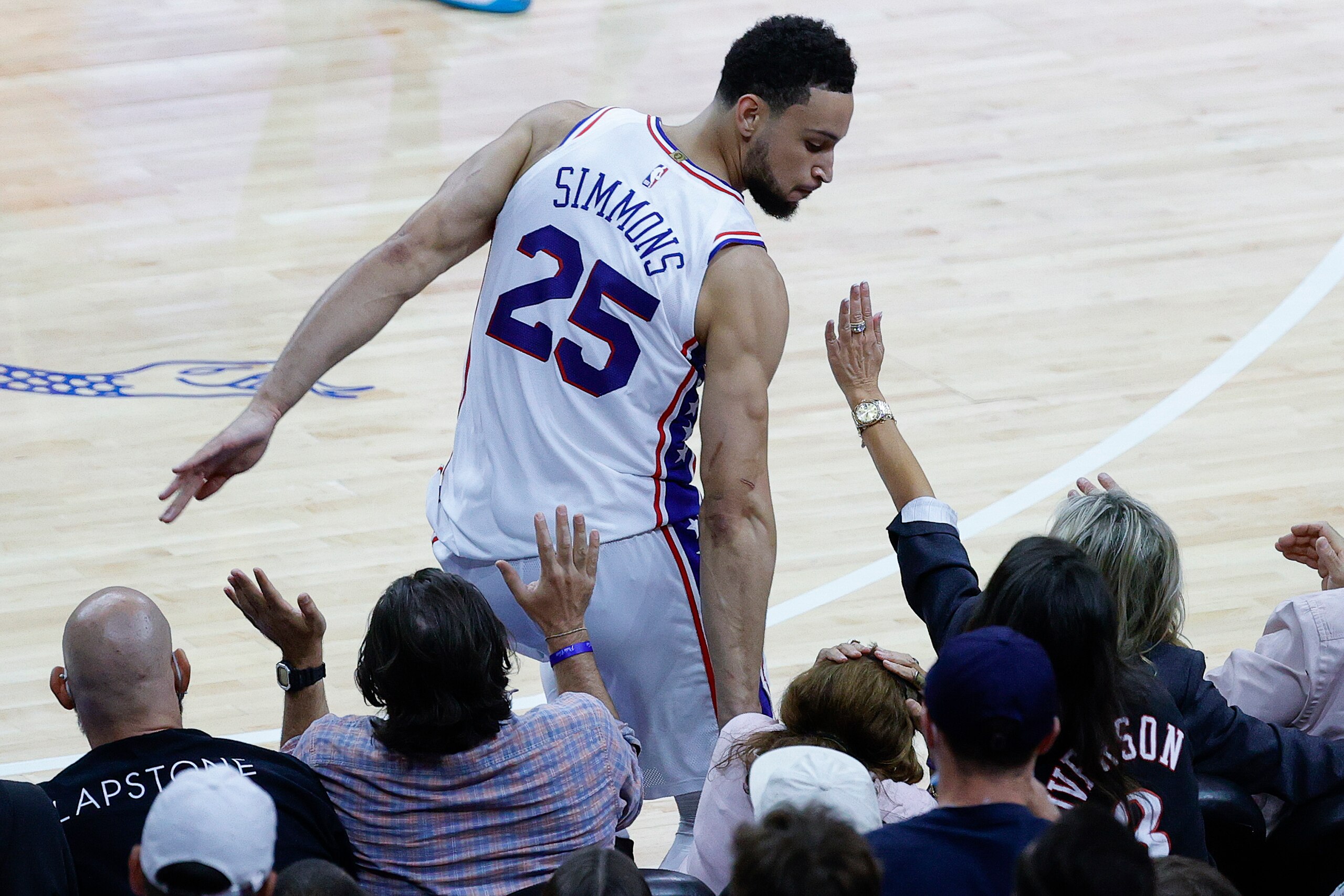PHILADELPHIA, PENNSYLVANIA - JUNE 20: Ben Simmons #25 of the Philadelphia 76ers bumps into fans during the fourth quarter during Game Seven of the Eastern Conference Semifinals against the Atlanta Hawks at Wells Fargo Center on June 20, 2021 in Philadelphia, Pennsylvania. NOTE TO USER: User expressly acknowledges and agrees that, by downloading and or using this photograph, User is consenting to the terms and conditions of the Getty Images License Agreement. (Photo by Tim Nwachukwu/Getty Images)