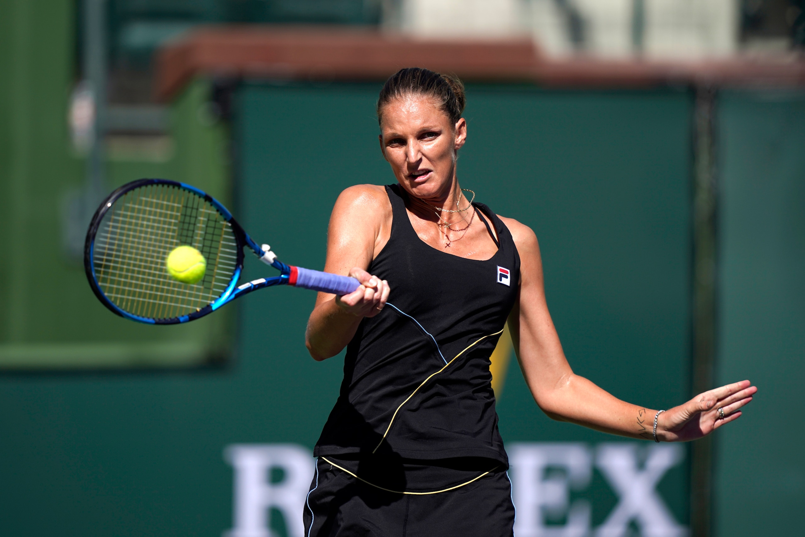 Karolina Pliskova, of the Czech Republic, returns a shot to Magdalena Frech, of Poland, at the BNP Paribas Open tennis tournament Saturday, Oct. 9, 2021, in Indian Wells, Calif. (AP Photo/Mark J. Terrill)