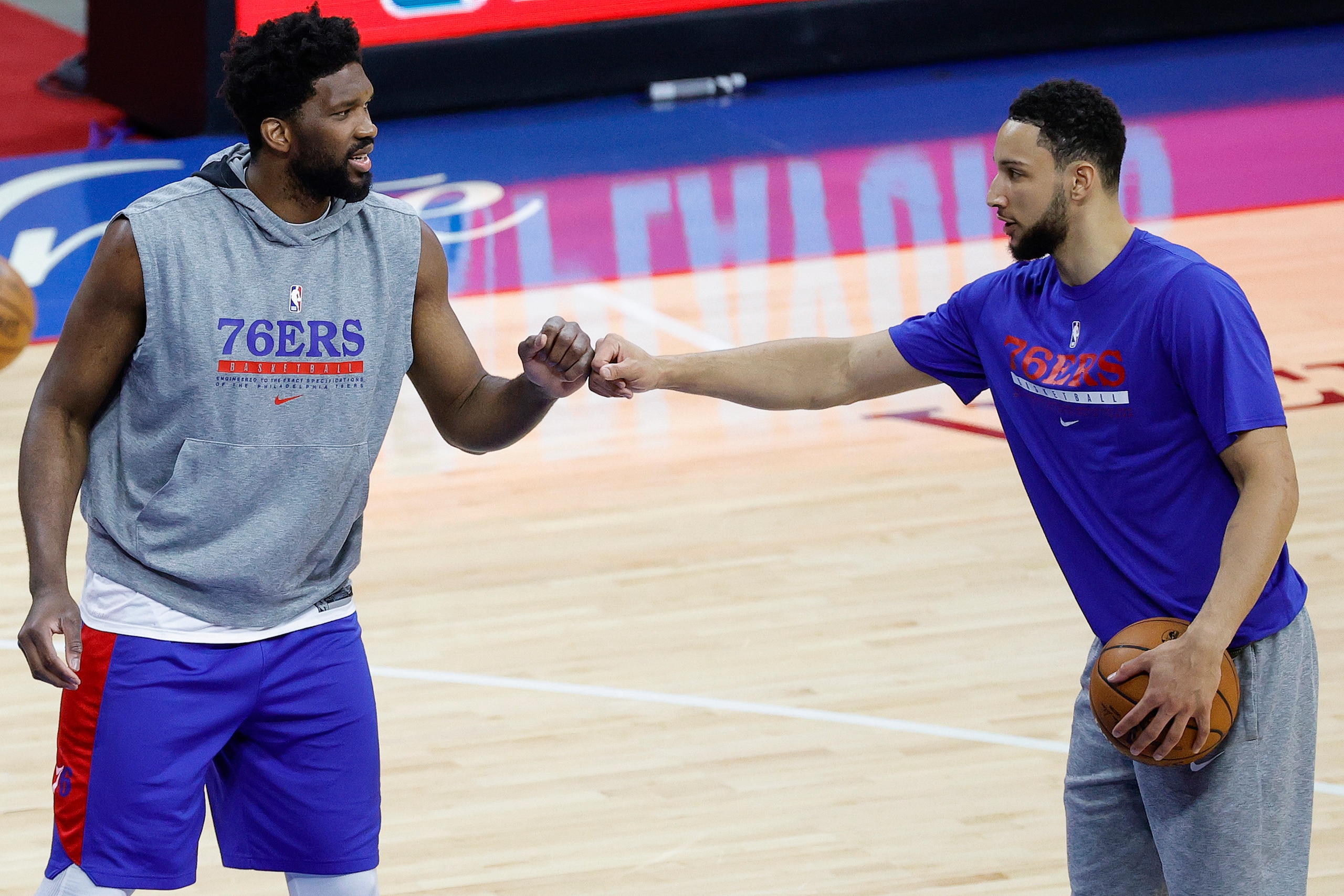 PHILADELPHIA, PENNSYLVANIA - JUNE 02: Joel Embiid #21 and Ben Simmons #25 of the Philadelphia 76ers warm up before playing against the Washington Wizards during Game Five of the Eastern Conference first round series at Wells Fargo Center on June 2, 2021 in Philadelphia, Pennsylvania. NOTE TO USER: User expressly acknowledges and agrees that, by downloading and or using this photograph, User is consenting to the terms and conditions of the Getty Images License Agreement. (Photo by Tim Nwachukwu/Getty Images)