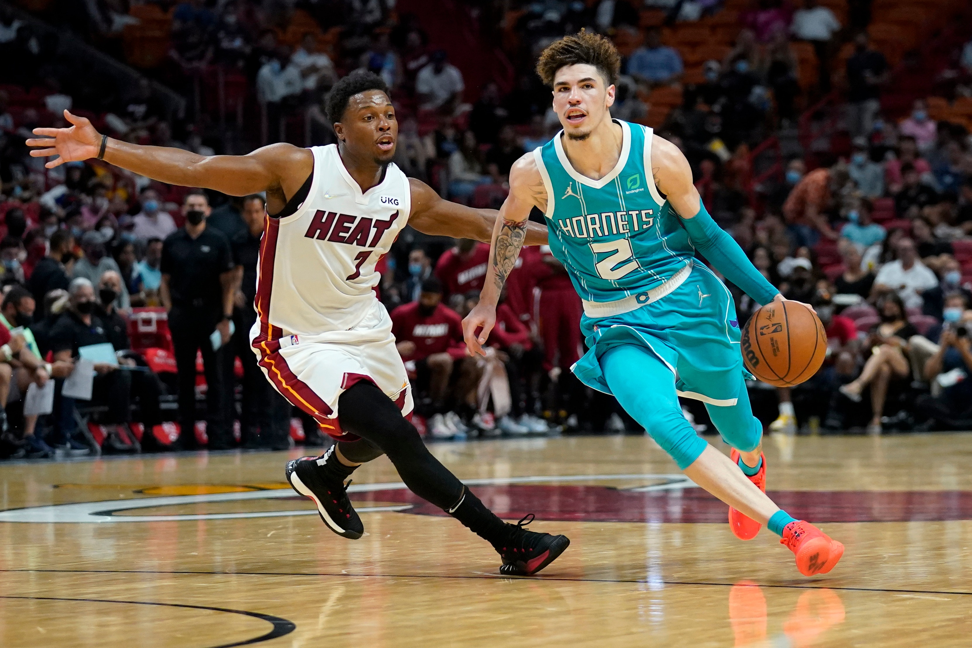 Miami Heat guard Kyle Lowry (7) defends against Charlotte Hornets guard LaMelo Ball (2) during the second half of a preseason NBA basketball game, Monday, Oct. 11, 2021, in Miami. (AP Photo/Lynne Sladky)