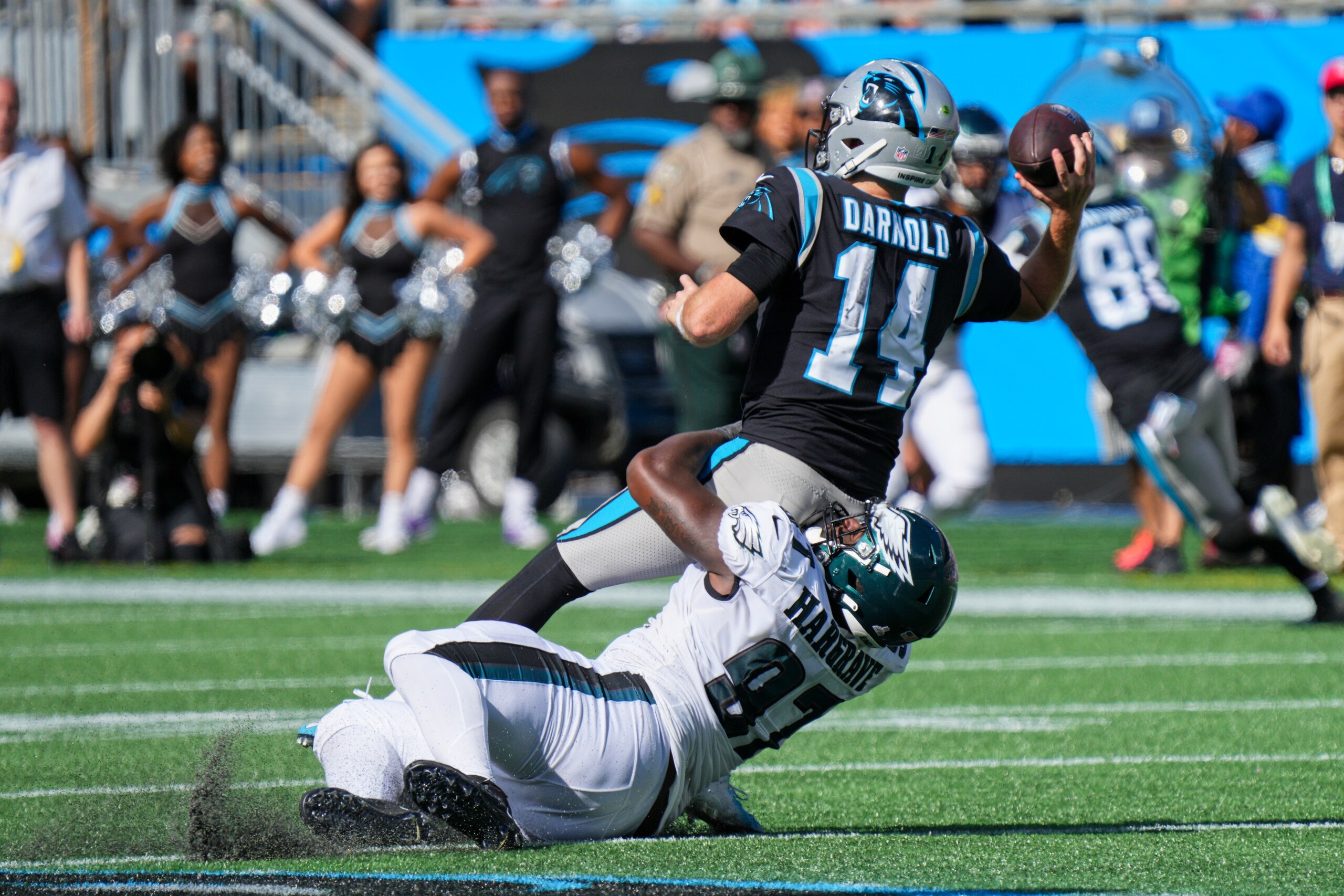 CHARLOTTE, NC - OCTOBER 10: Philadelphia Eagles defensive tackle Javon Hargrave (97) hurries Carolina Panthers quarterback Sam Darnold (14) during the game between the Carolina Panthers and the Philadelphia Eagles on October 10, 2021 at Bank of America Stadium in Charlotte, NC. (Photo by Andy Lewis/Icon Sportswire via Getty Images)