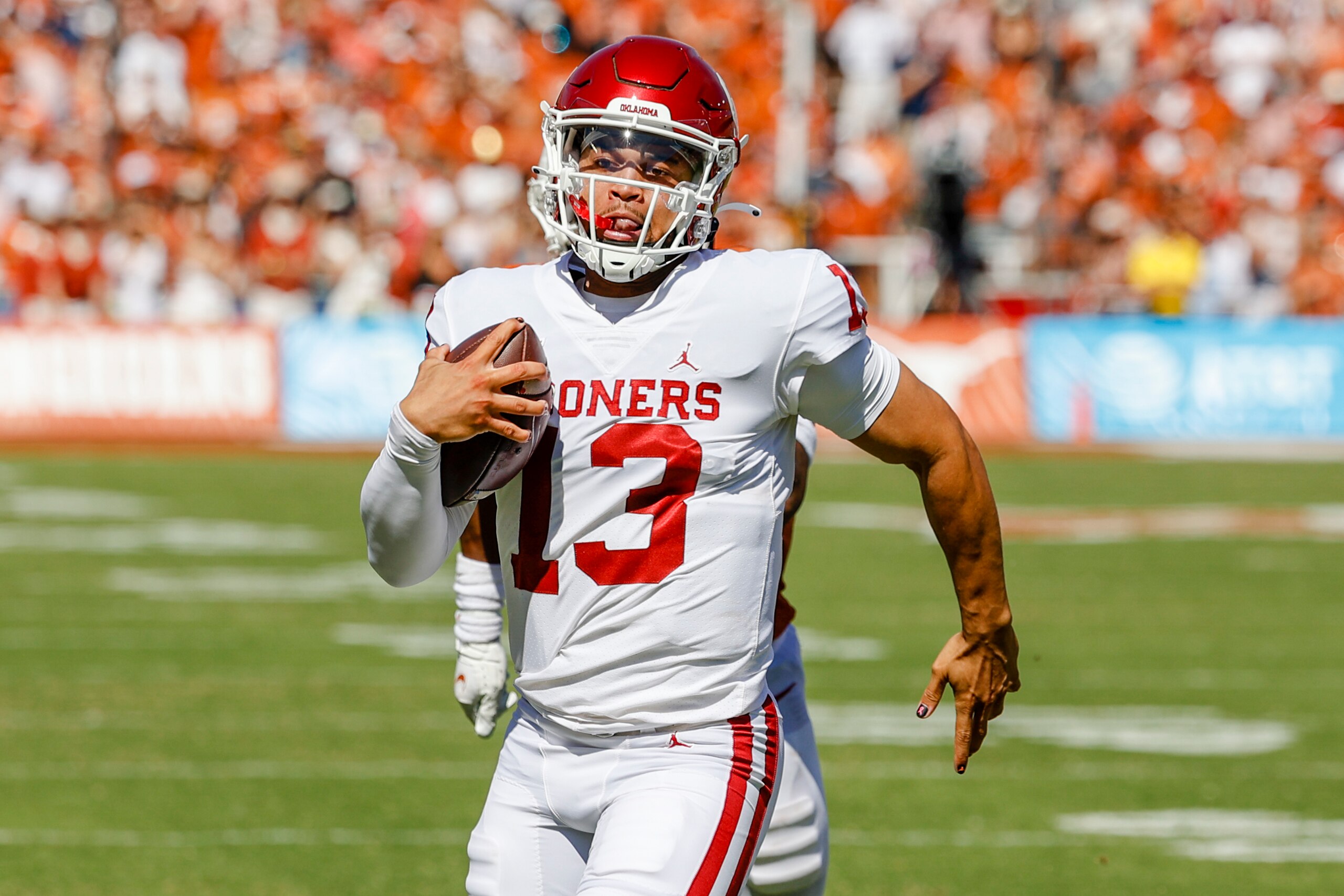 DALLAS, TX - OCTOBER 09: Oklahoma Sooners quarterback Caleb Williams (13) runs for a touchdown during the Red River Showdown between the Texas Longhorns and the Oklahoma Sooners on October 09, 2021 at the Cotton Bowl in Dallas, Texas. (Photo by Matthew Pearce/Icon Sportswire via Getty Images) DALLAS, TX - OCTOBER 09: Oklahoma Sooners quarterback Caleb Williams (13) runs for a touchdown during the Red River Showdown between the Texas Longhorns and the Oklahoma Sooners on October 09, 2021 at the Cotton Bowl in Dallas, Texas. (Photo by Matthew Pearce/Icon Sportswire via Getty Images)