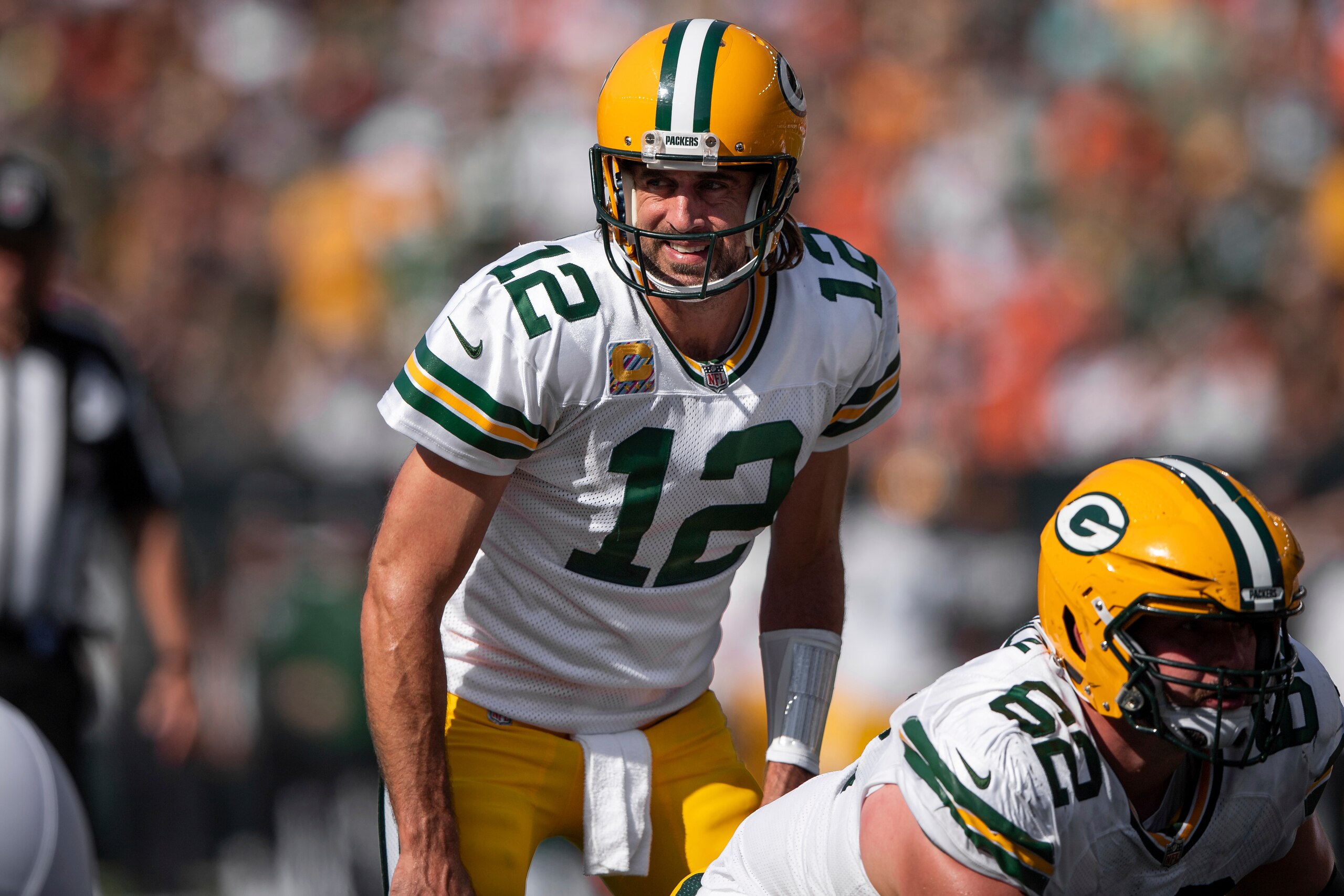 Green Bay Packers quarterback Aaron Rodgers (12) looks over the defense before the snap during an NFL football game against the Cincinnati Bengals, Sunday, Oct. 10, 2021, in Cincinnati. (AP Photo/Zach Bolinger)