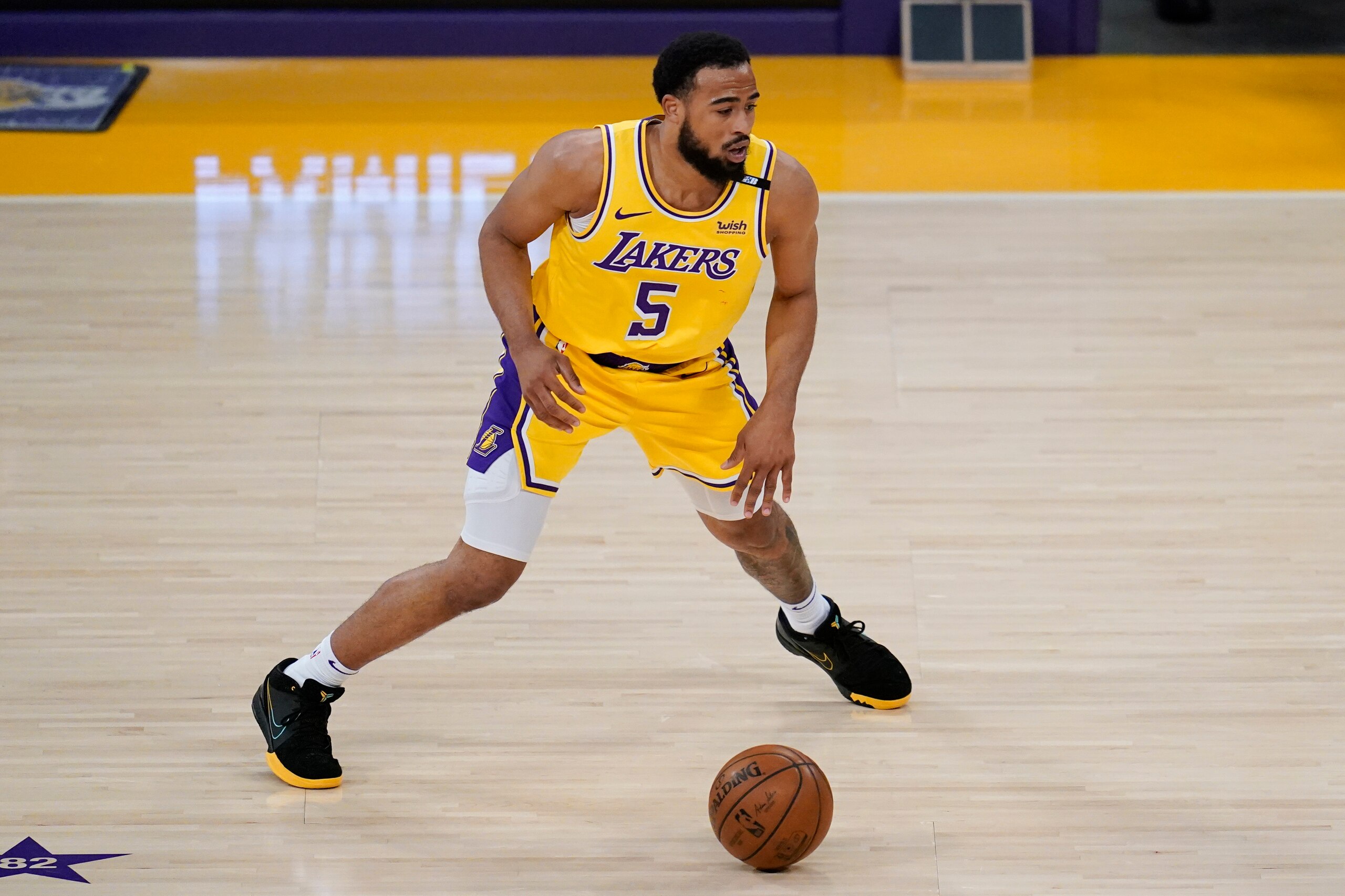 Los Angeles Lakers guard Talen Horton-Tucker (5) controls the ball during Game 6 of an NBA basketball first-round playoff series against the Phoenix Suns Thursday, Jun 3, 2021, in Los Angeles. (AP Photo/Ashley Landis)