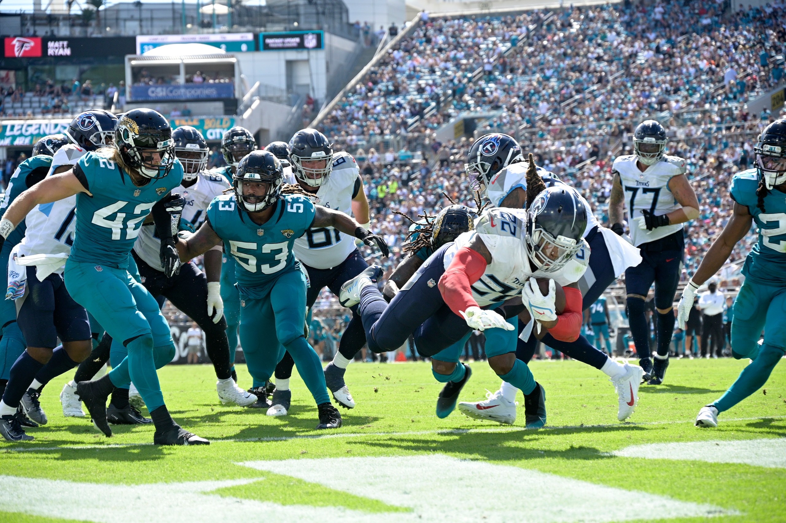 Tennessee Titans running back Derrick Henry (22) dives into the end zone on a 9-yard touchdown run during the second half of an NFL football game against the Jacksonville Jaguars, Sunday, Oct. 10, 2021, in Jacksonville, Fla. (AP Photo/Phelan M. Ebenhack) Tennessee Titans running back Derrick Henry (22) dives into the end zone on a 9-yard touchdown run during the second half of an NFL football game against the Jacksonville Jaguars, Sunday, Oct. 10, 2021, in Jacksonville, Fla. (AP Photo/Phelan M. Ebenhack)