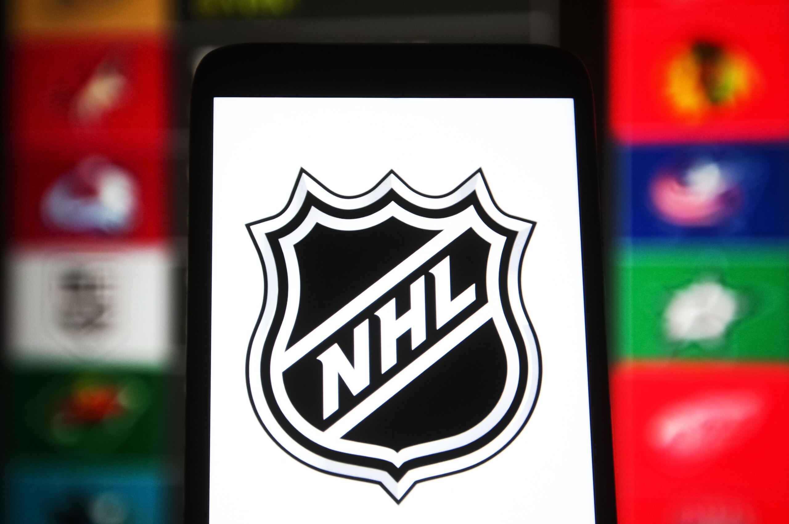 UKRAINE - 2021/08/29: In this photo illustration, National Hockey League (NHL) logo is seen on a smartphone screen. (Photo Illustration by Pavlo Gonchar/SOPA Images/LightRocket via Getty Images) UKRAINE - 2021/08/29: In this photo illustration, National Hockey League (NHL) logo is seen on a smartphone screen. (Photo Illustration by Pavlo Gonchar/SOPA Images/LightRocket via Getty Images)