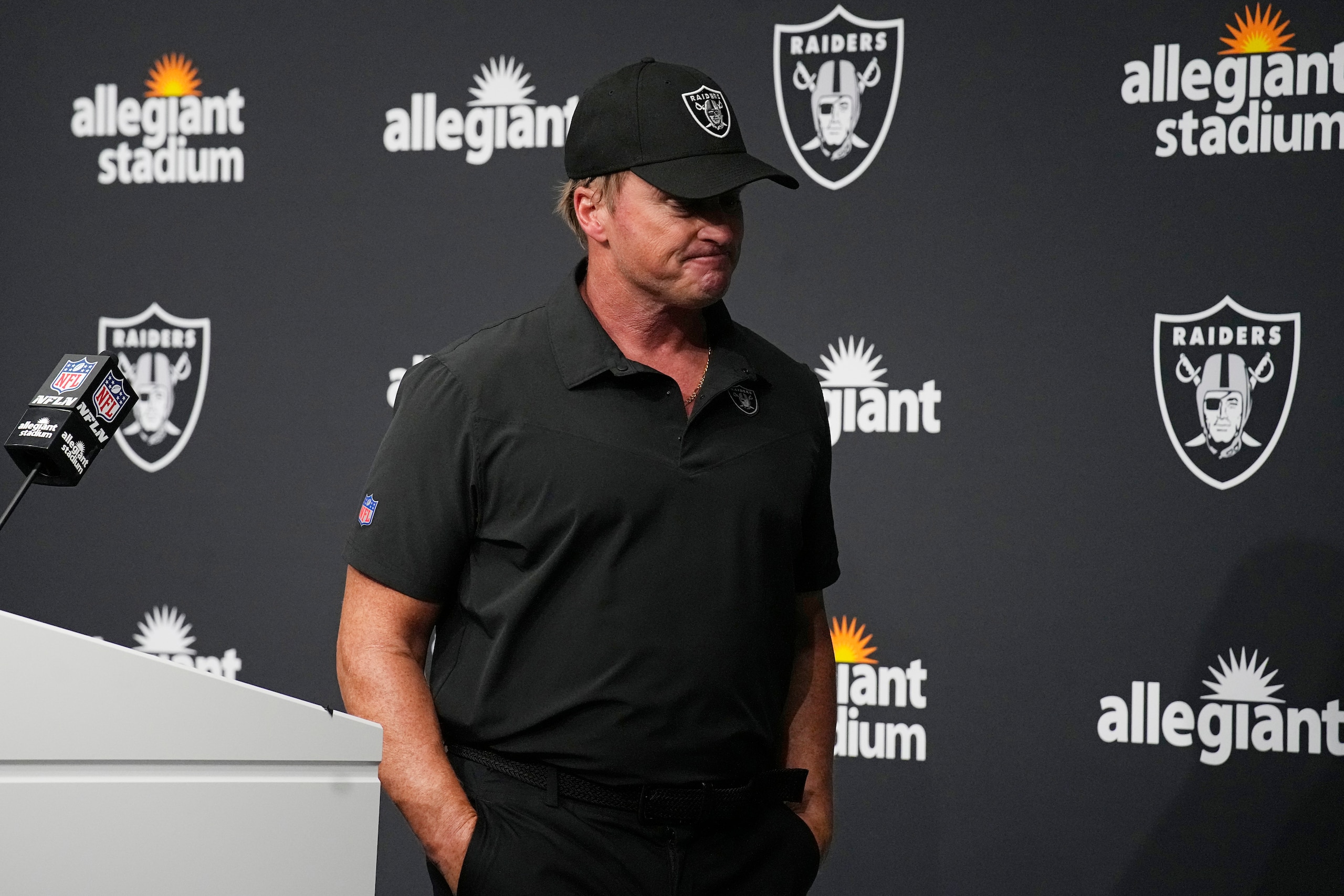 Las Vegas Raiders head coach Jon Gruden leaves after speaking during a news conference after an NFL football game against the Chicago Bears, Sunday, Oct. 10, 2021, in Las Vegas. (AP Photo/Rick Scuteri)
