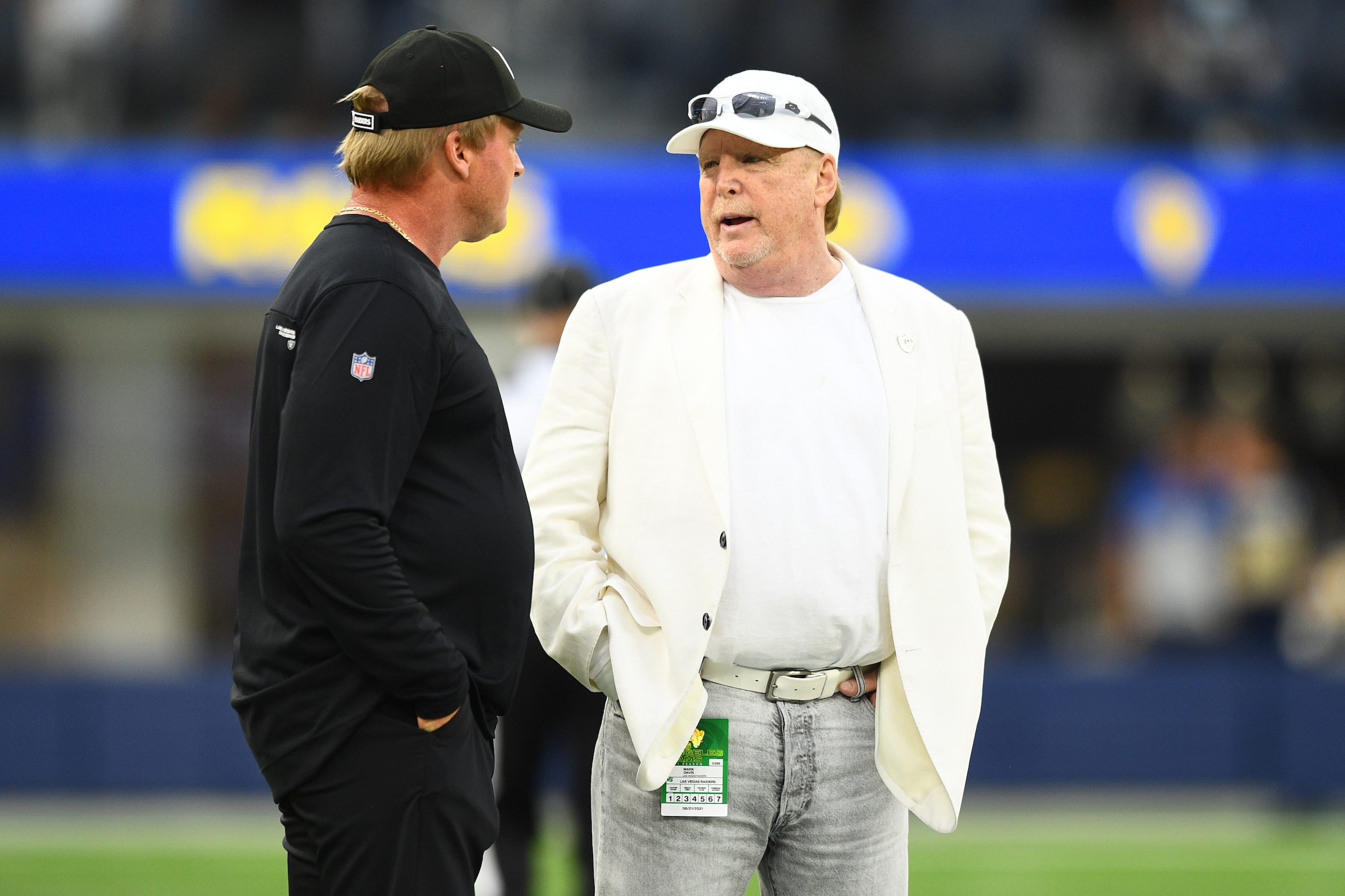 INGLEWOOD, CA - AUGUST 21: Las Vegas Raiders owner Mark Davis talks with head coach Jon Gruden before the NFL preseason game between the Las Vegas Raiders and the Los Angeles Rams on August 21, 2021, at SoFi Stadium in Inglewood, CA. (Photo by Brian Rothmuller/Icon Sportswire via Getty Images)