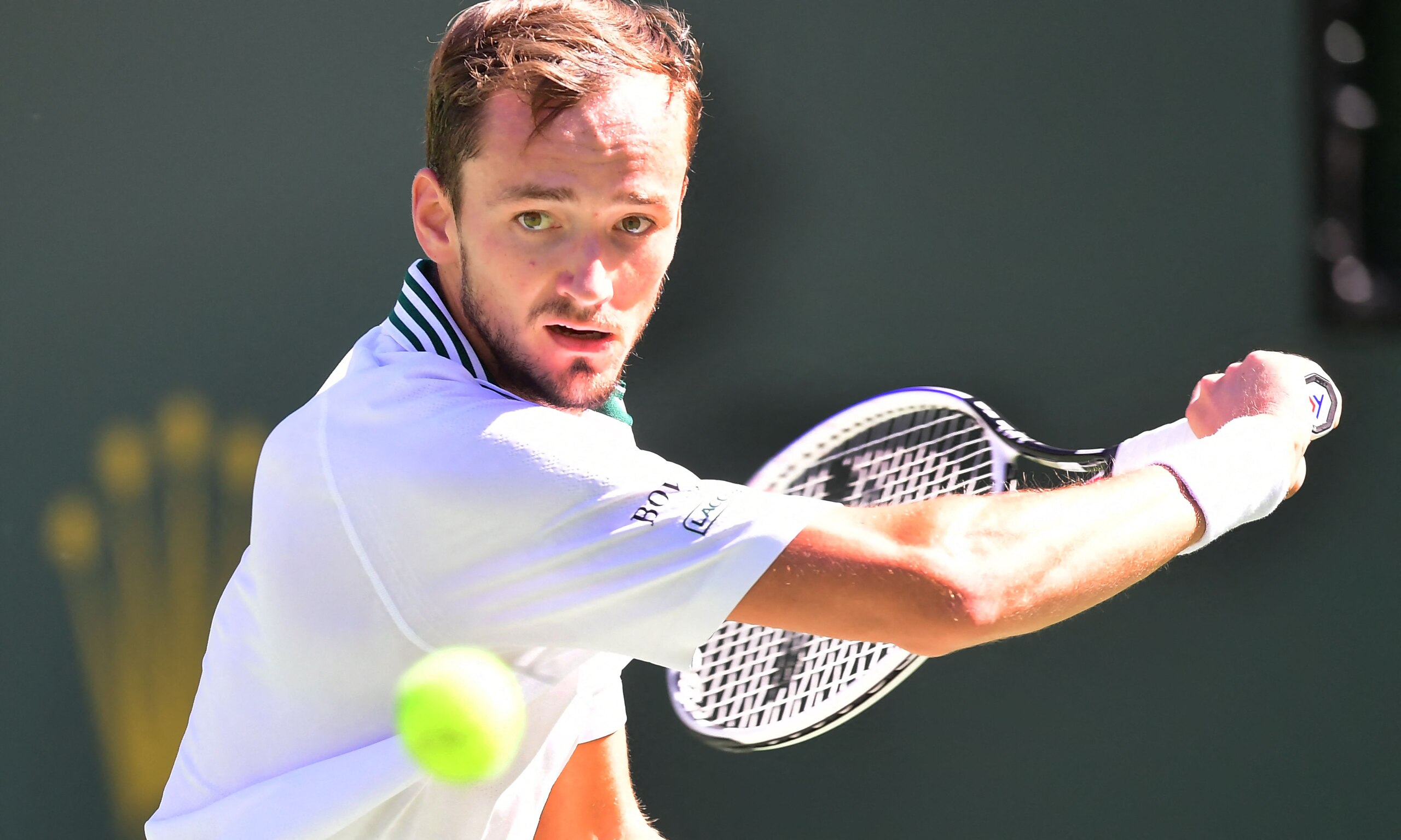 Danil Medvedev of Russia eyes a backhand return to Grigor Dimitrov of Bulgaria in their Round of 16 match at the Indian Wells tennis tournament on October 13, 2021 in Indian Wells, California. (Photo by Frederic J. BROWN / AFP) (Photo by FREDERIC J. BROWN/AFP via Getty Images)