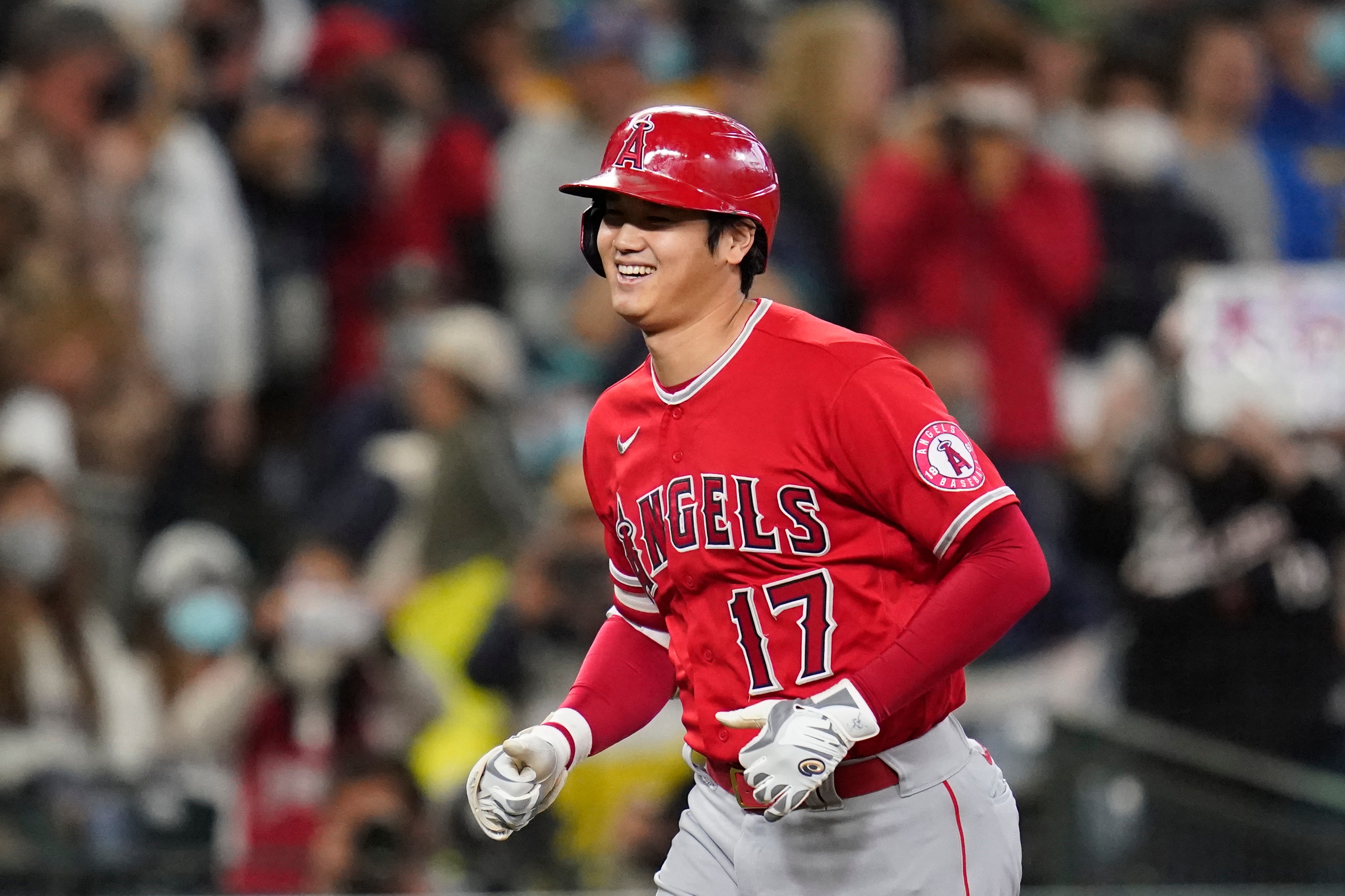 Los Angeles Angels' Shohei Ohtani heads home on his solo home run against the Seattle Mariners in the first inning of a baseball game Sunday, Oct. 3, 2021, in Seattle. (AP Photo/Elaine Thompson)