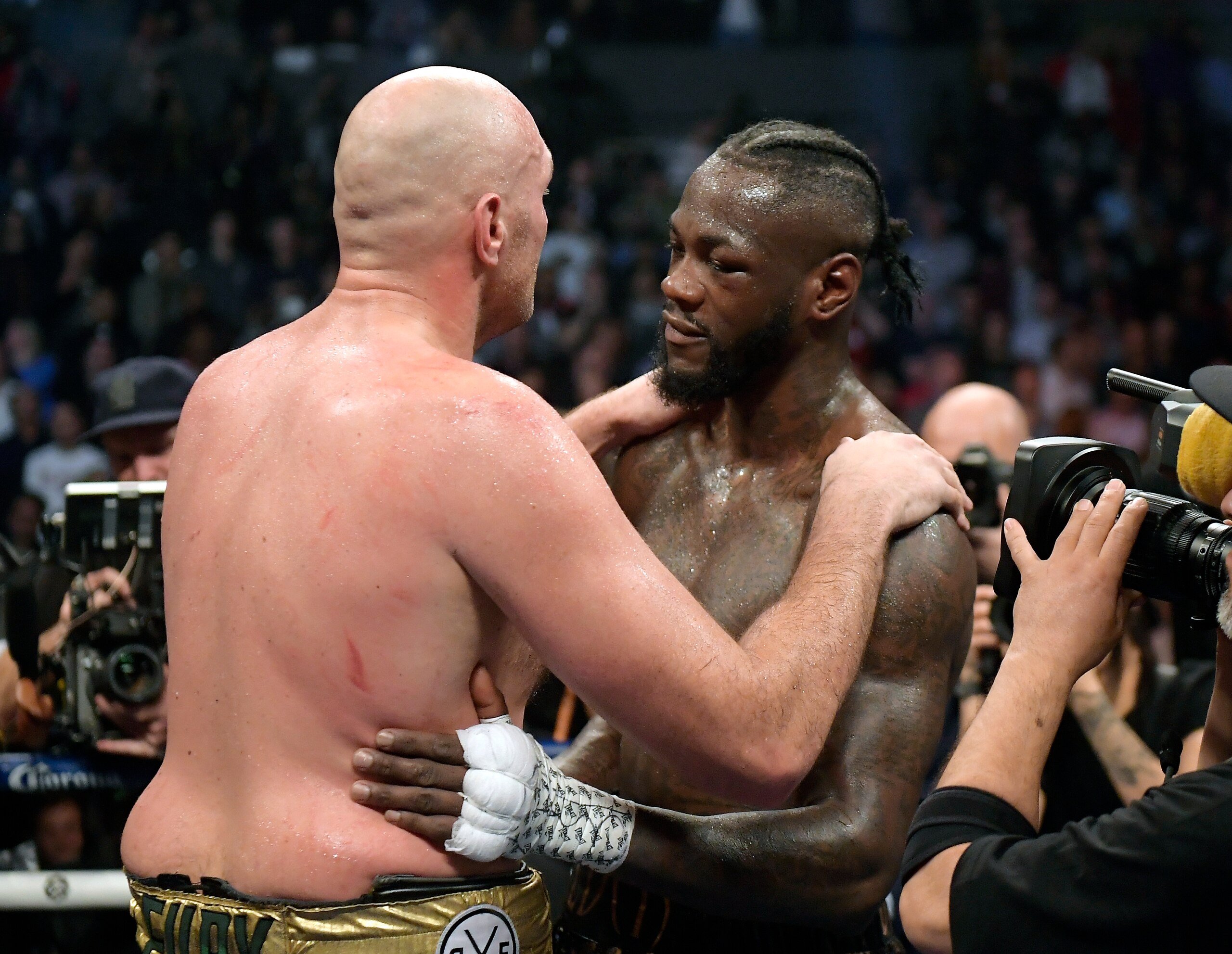 Tyson Fury, left, of England, and Deontay Wilder embrace after their WBC heavyweight championship boxing match, Saturday, Dec. 1, 2018, in Los Angeles. The fight ended in a draw. (AP Photo/Mark J. Terrill) Tyson Fury, left, of England, and Deontay Wilder embrace after their WBC heavyweight championship boxing match, Saturday, Dec. 1, 2018, in Los Angeles. The fight ended in a draw. (AP Photo/Mark J. Terrill)