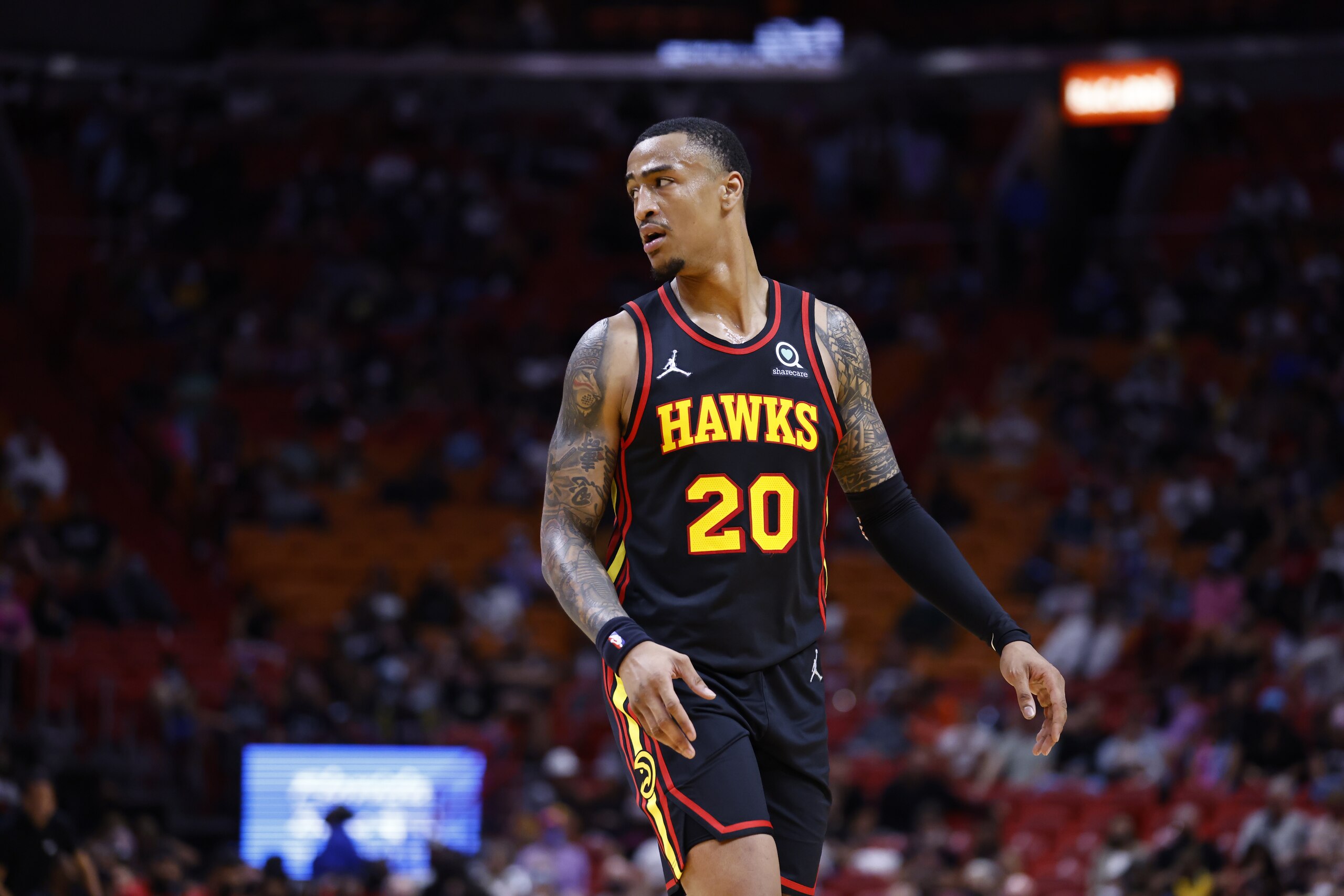 MIAMI, FL - OCTOBER 4: John Collins #20 of the Atlanta Hawks looks on during a preseason game against the Miami Heat on October 4, 2021 at FTX Arena in Miami, Florida. NOTE TO USER: User expressly acknowledges and agrees that, by downloading and or using this Photograph, user is consenting to the terms and conditions of the Getty Images License Agreement. Mandatory Copyright Notice: Copyright 2021 NBAE (Photo by Michael Reaves/NBAE via Getty Images) MIAMI, FL - OCTOBER 4: John Collins #20 of the Atlanta Hawks looks on during a preseason game against the Miami Heat on October 4, 2021 at FTX Arena in Miami, Florida. NOTE TO USER: User expressly acknowledges and agrees that, by downloading and or using this Photograph, user is consenting to the terms and conditions of the Getty Images License Agreement. Mandatory Copyright Notice: Copyright 2021 NBAE (Photo by Michael Reaves/NBAE via Getty Images)