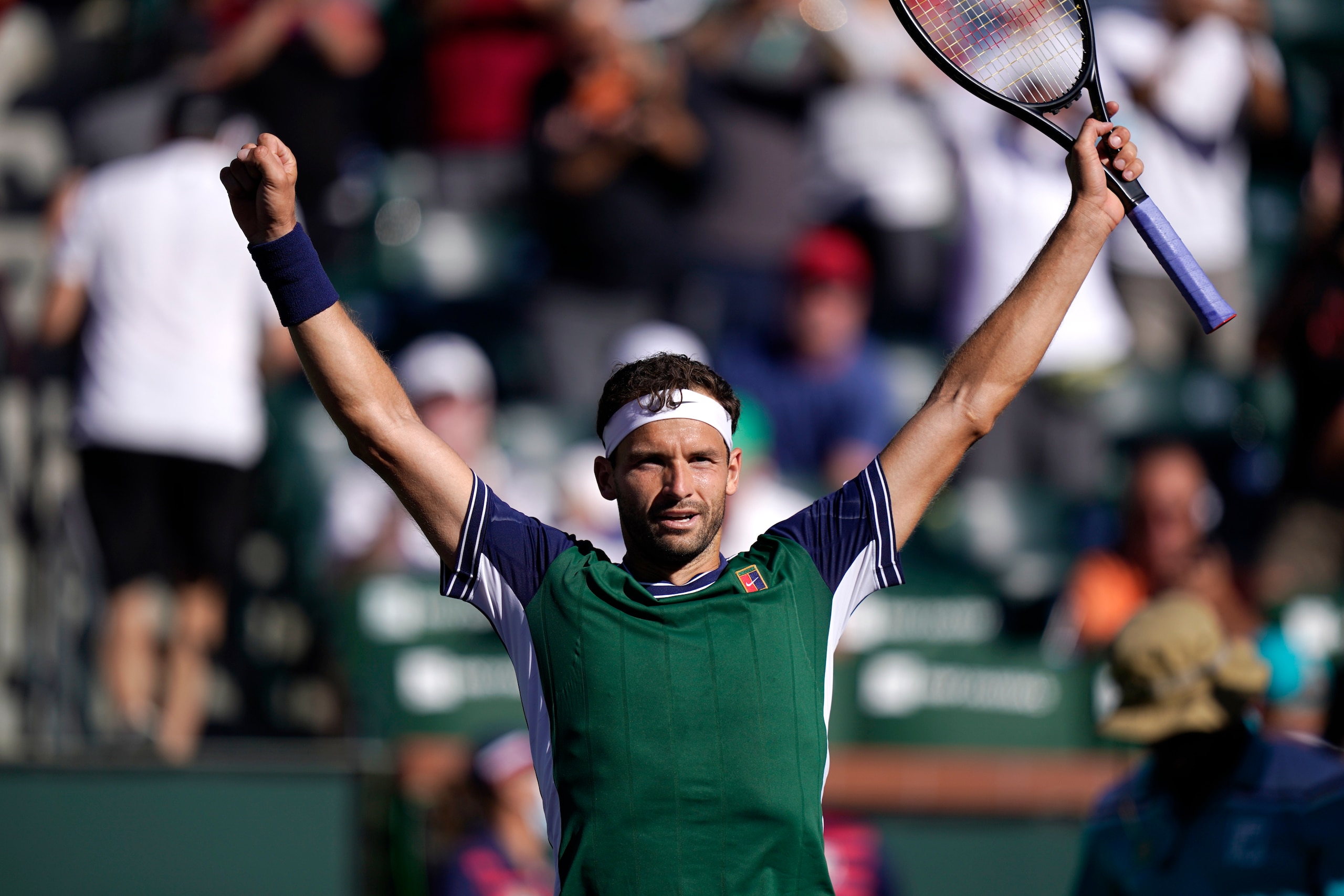 Grigor Dimitrov, of Bulgaria, reacts after beating Hubert Hurkacz, of Poland, at the BNP Paribas Open tennis tournament Thursday, Oct. 14, 2021, in Indian Wells, Calif. (AP Photo/Mark J. Terrill)