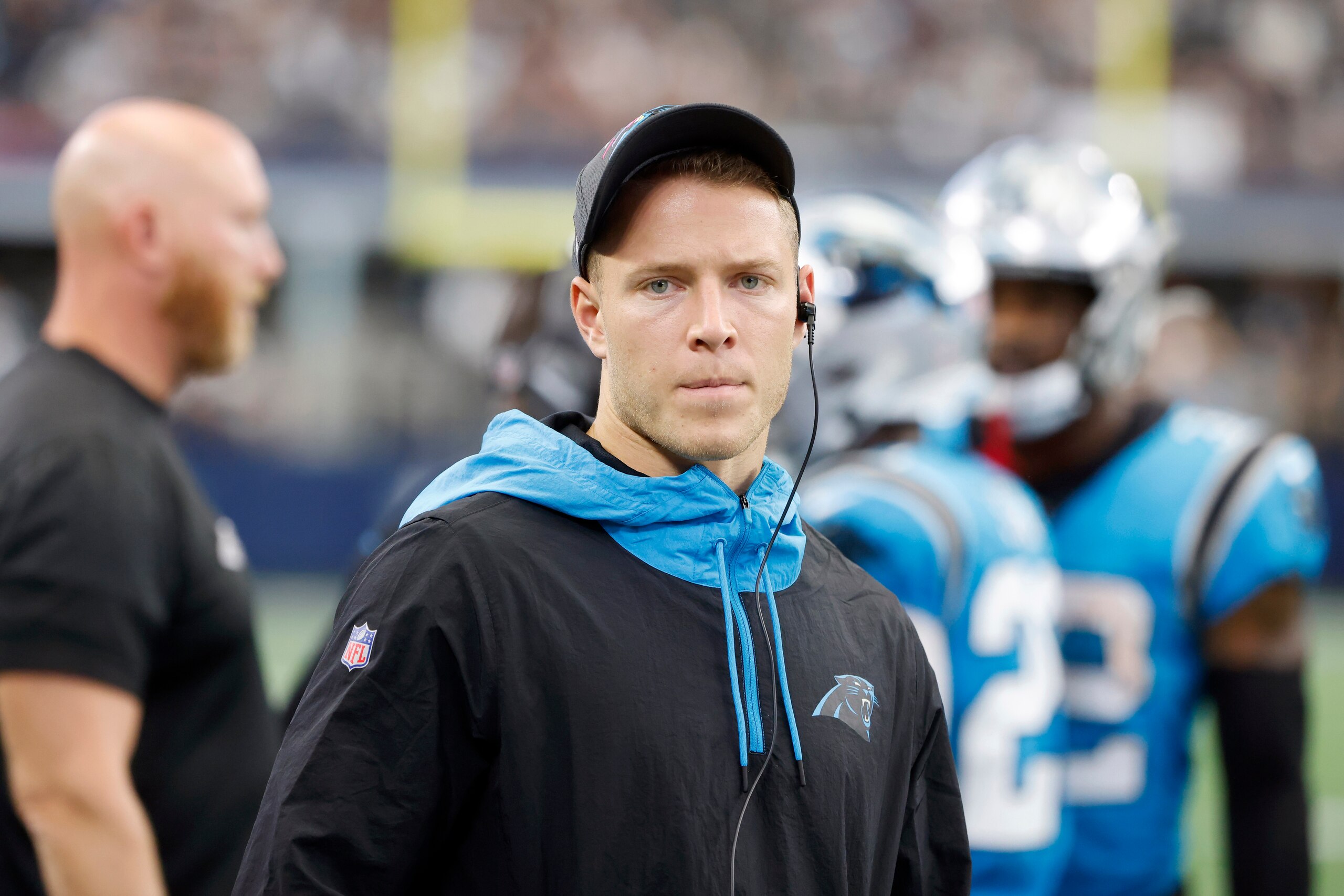 FILE - In this Sunday, Oct. 3, 2021, file photo, Carolina Panthers running back Christian McCaffrey watches play from the sideline during the first half of a NFL football game against the Dallas Cowboys in Arlington, Texas. McCaffrey did not practice Thursday, Oct. 14, 2021, a sign that he could miss his third straight game while trying to rehab from a hamstring injury. (AP Photo/Michael Ainsworth)