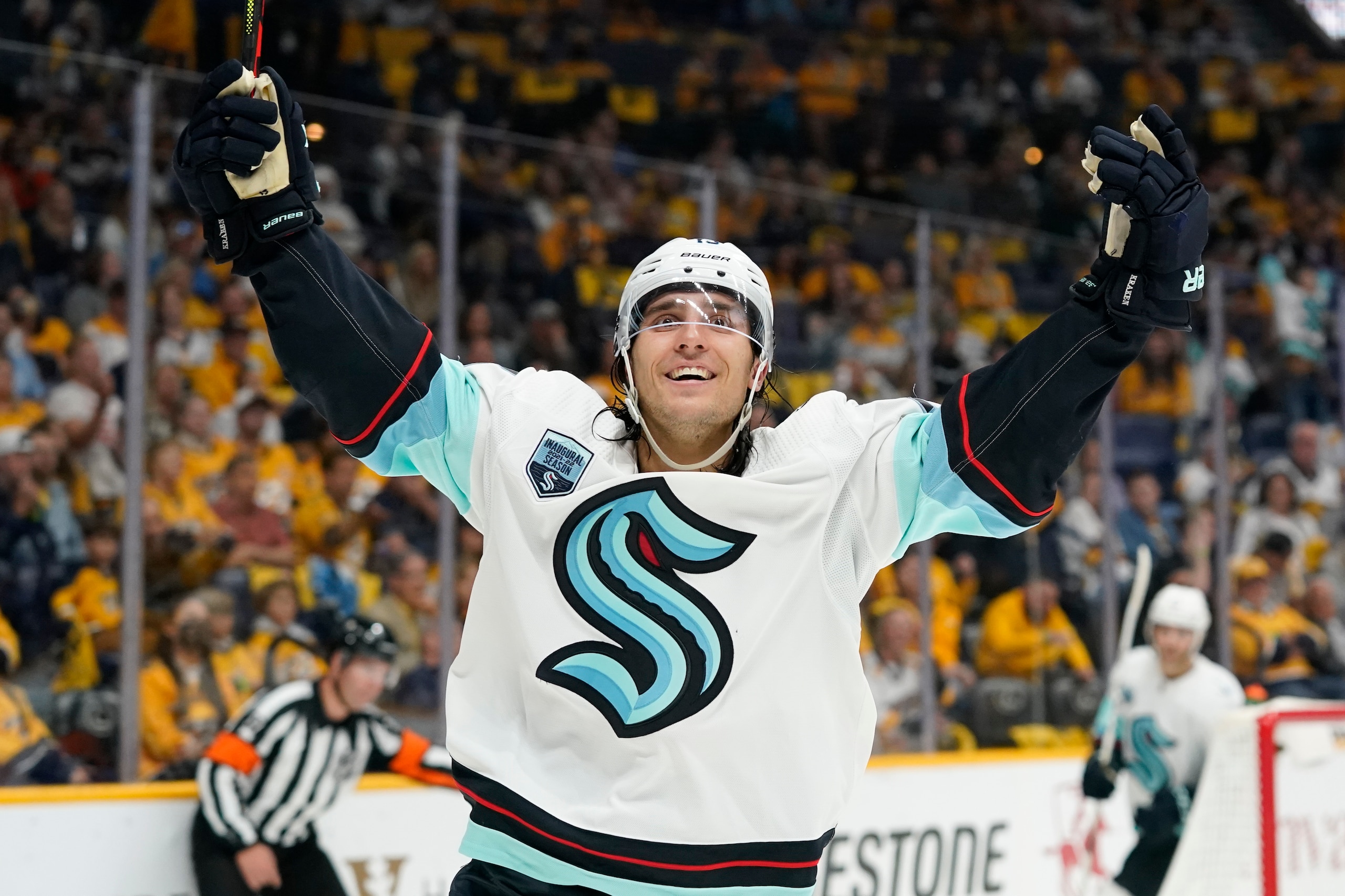 Seattle Kraken left wing Brandon Tanev celebrates after scoring a goal against the Nashville Predators in the first period of an NHL hockey game Thursday, Oct. 14, 2021, in Nashville, Tenn. (AP Photo/Mark Humphrey)