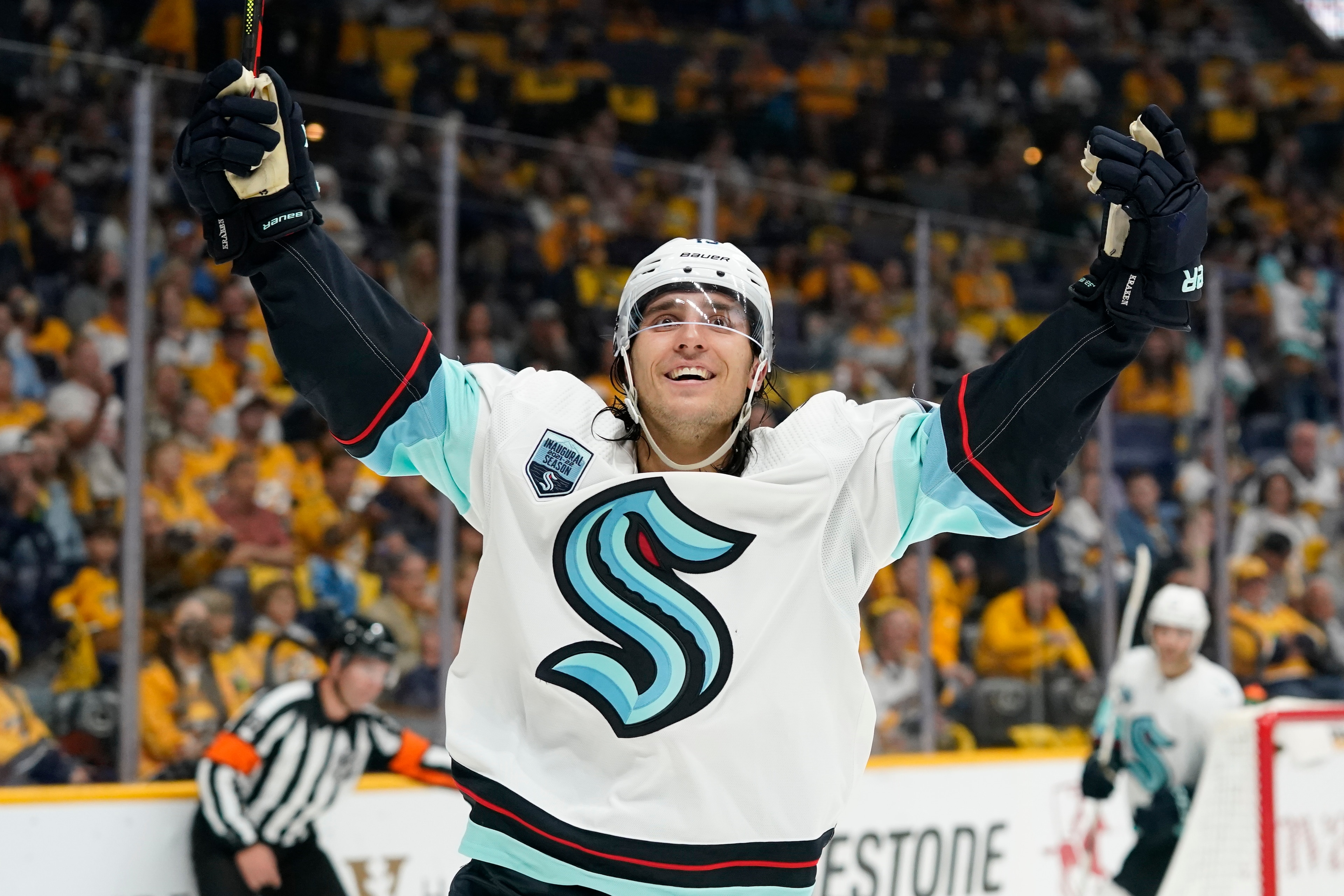 Seattle Kraken left wing Brandon Tanev celebrates after scoring a goal against the Nashville Predators in the first period of an NHL hockey game Thursday, Oct. 14, 2021, in Nashville, Tenn. (AP Photo/Mark Humphrey)