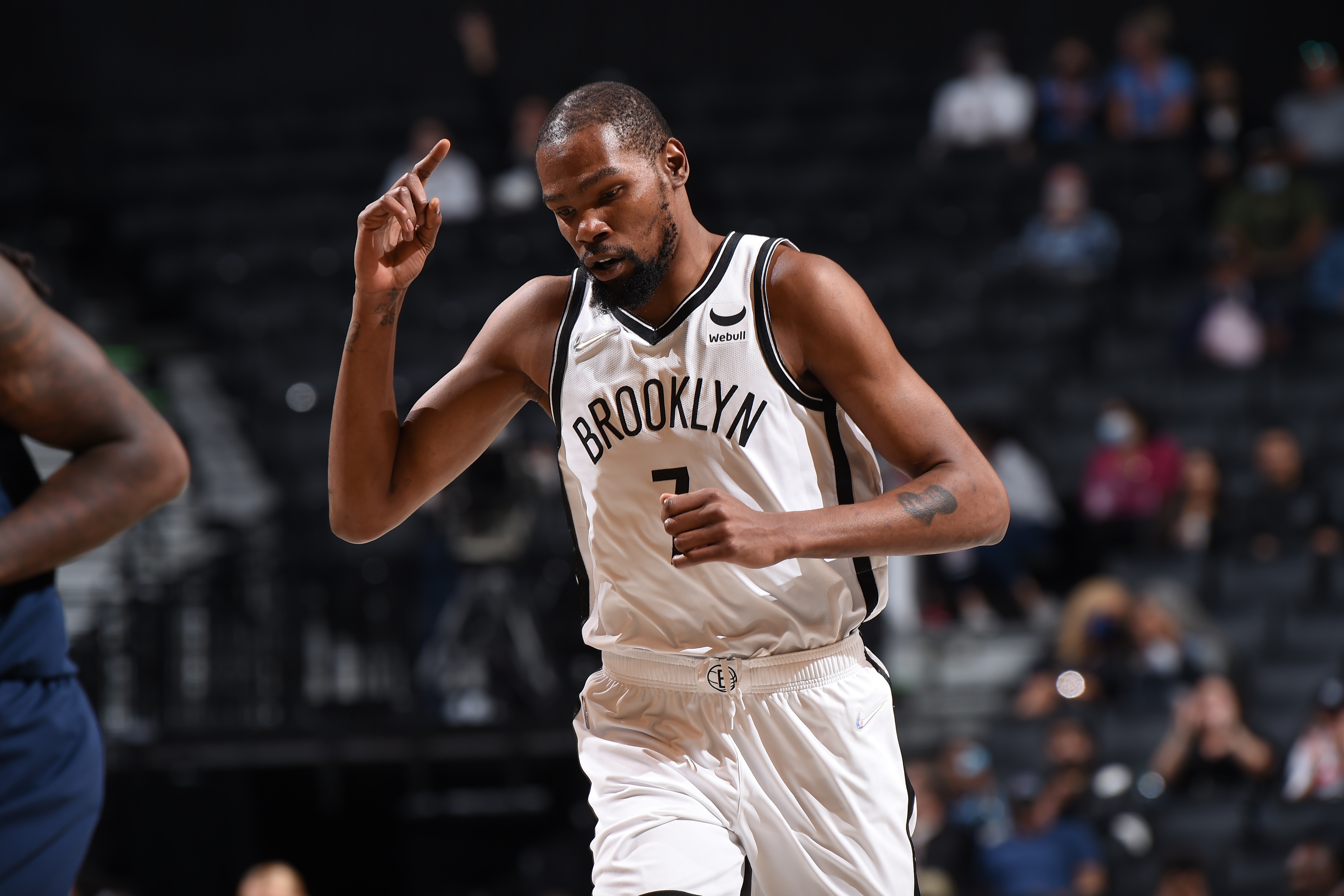 BROOKLYN, NY - OCTOBER 14: Kevin Durant #7 of the Brooklyn Nets reacts during a preseason game on October 14, 2021 at Barclays Center in Brooklyn, New York. NOTE TO USER: User expressly acknowledges and agrees that, by downloading and/or using this Photograph, user is consenting to the terms and conditions of the Getty Images License Agreement. Mandatory Copyright Notice: Copyright 2021 NBAE (Photo by David Dow/NBAE via Getty Images)