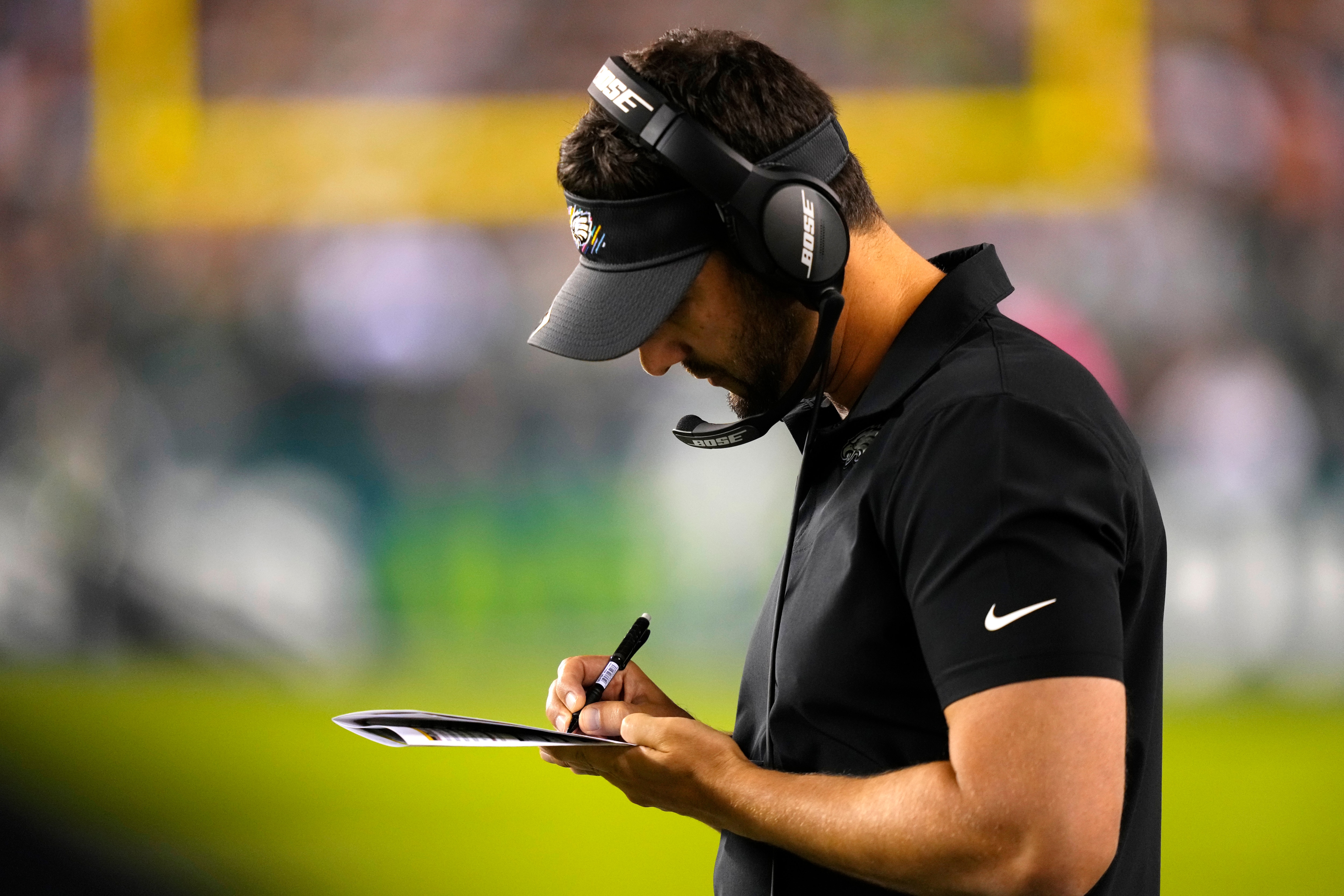 Philadelphia Eagles head coach Nick Sirianni writes during the first half of an NFL football game against the Tampa Bay Buccaneers on Thursday, Oct. 14, 2021, in Philadelphia. (AP Photo/Matt Slocum)