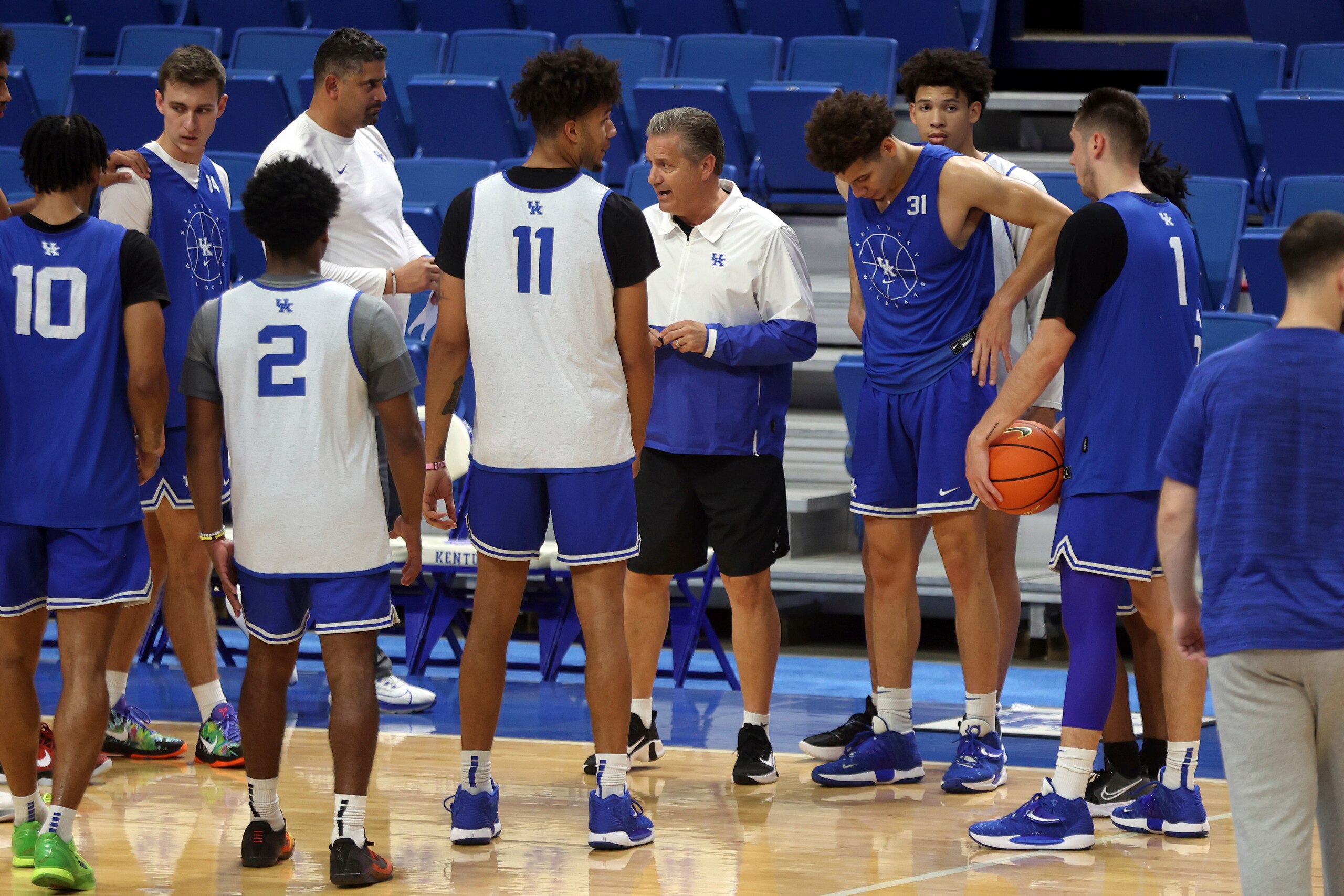 Kentucky head coach John Calipari, center, instructs his team during an NCAA college basketball open house practice in Lexington, Ky., Monday, Oct. 11, 2021. (AP Photo/James Crisp) Kentucky head coach John Calipari, center, instructs his team during an NCAA college basketball open house practice in Lexington, Ky., Monday, Oct. 11, 2021. (AP Photo/James Crisp)