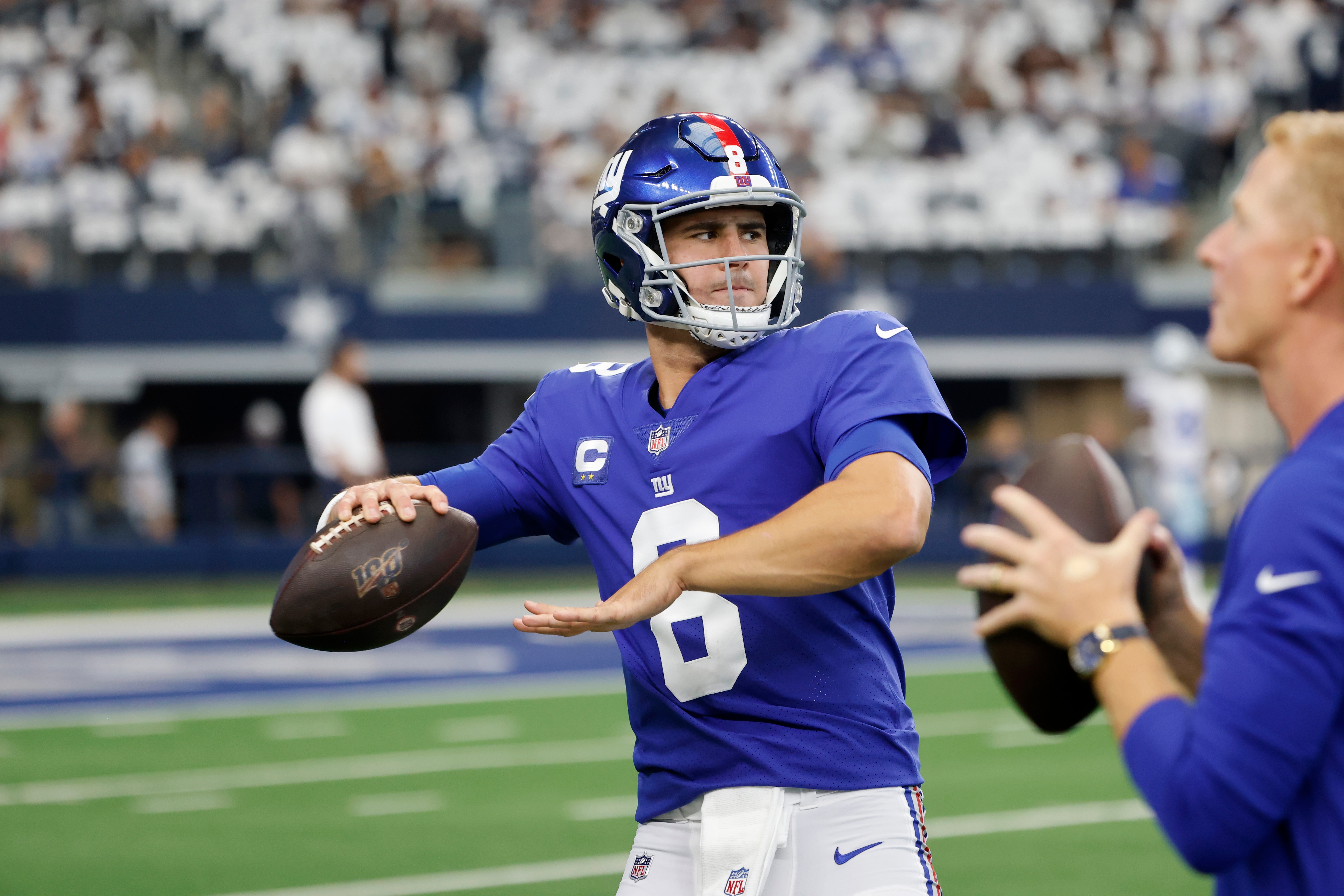 New York Giants quarterback Daniel Jones (8) warms up prior to playing the Dallas Cowboys during an NFL football game in Arlington, Texas, Sunday, Oct. 10, 2021. (AP Photo/Michael Ainsworth)