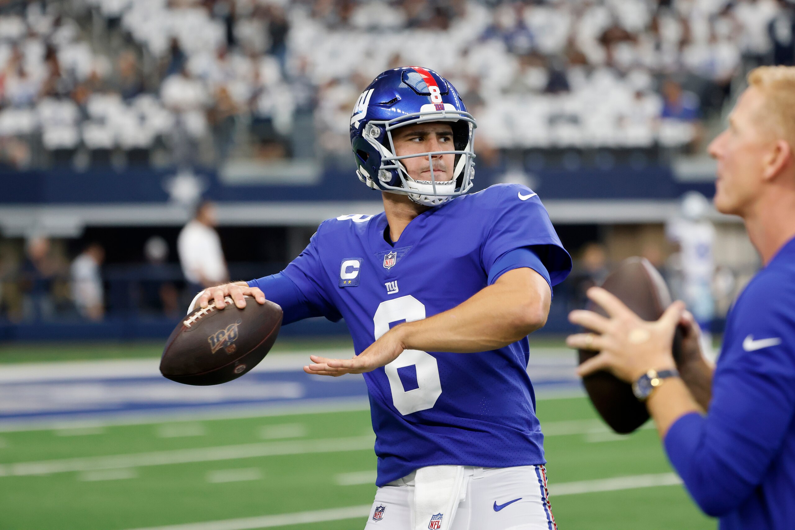 New York Giants quarterback Daniel Jones (8) warms up prior to playing the Dallas Cowboys during an NFL football game in Arlington, Texas, Sunday, Oct. 10, 2021. (AP Photo/Michael Ainsworth)