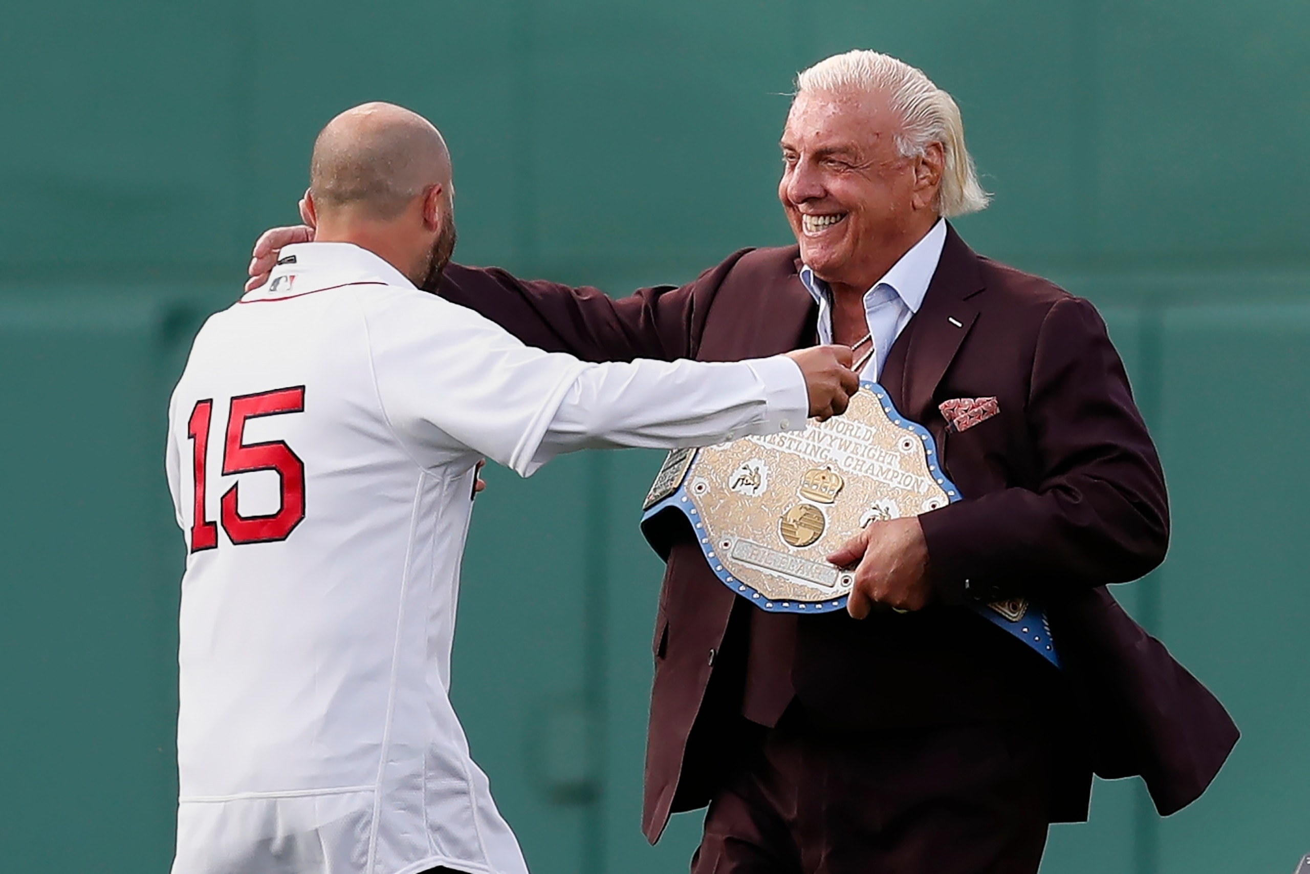 Professional wrestling manager Ric Flair greets former Boston Red Sox's Dustin Pedroia during pre-game ceremonies in honor of Pedroia before a baseball game against the New York Yankees, Friday, June 25, 2021, in Boston. (AP Photo/Michael Dwyer) Professional wrestling manager Ric Flair greets former Boston Red Sox's Dustin Pedroia during pre-game ceremonies in honor of Pedroia before a baseball game against the New York Yankees, Friday, June 25, 2021, in Boston. (AP Photo/Michael Dwyer)