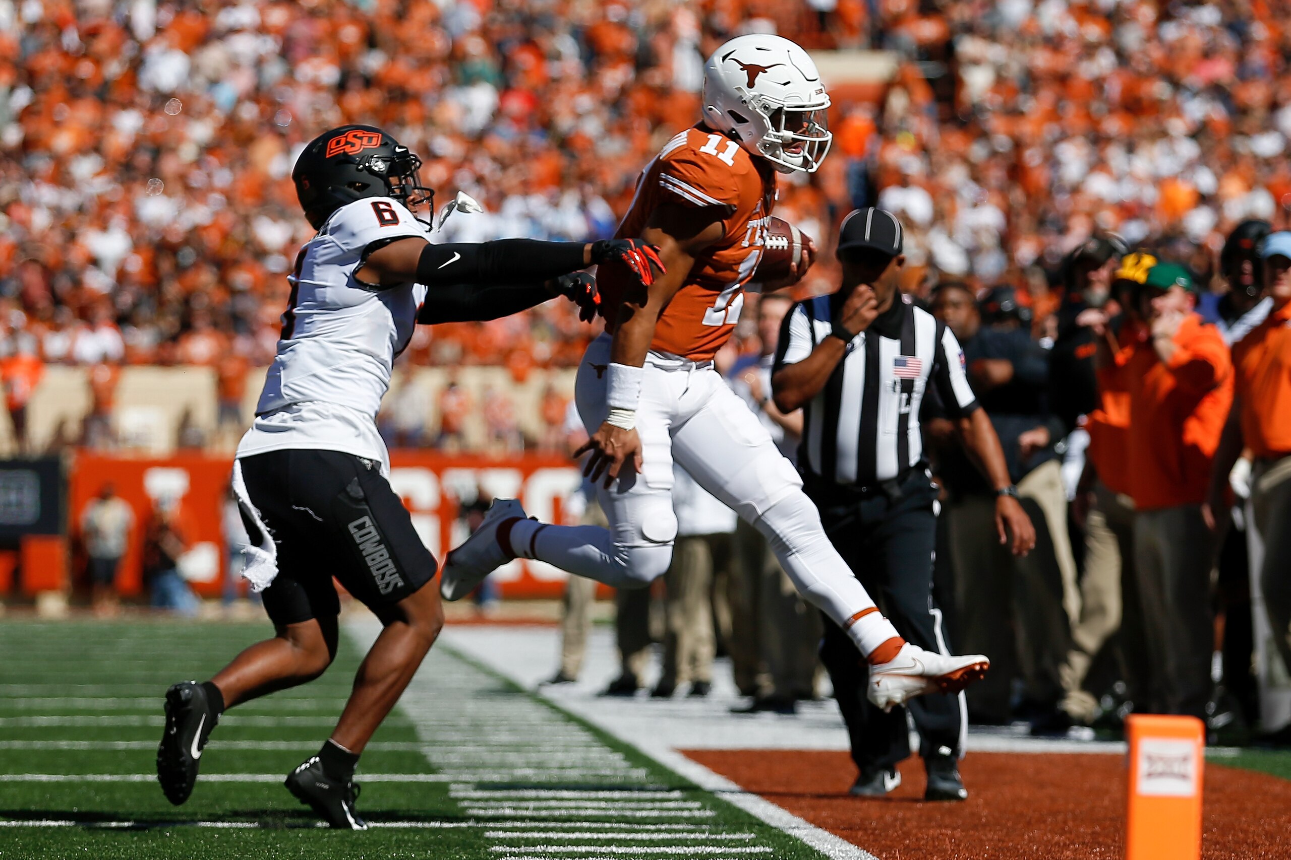 AUSTIN, TEXAS - OCTOBER 16: Jabbar Muhammad #6 of the Oklahoma State Cowboys forces Casey Thompson #11 of the Texas Longhorns out of bounds in the first quarter at Darrell K Royal-Texas Memorial Stadium on October 16, 2021 in Austin, Texas. (Photo by Tim Warner/Getty Images) AUSTIN, TEXAS - OCTOBER 16: Jabbar Muhammad #6 of the Oklahoma State Cowboys forces Casey Thompson #11 of the Texas Longhorns out of bounds in the first quarter at Darrell K Royal-Texas Memorial Stadium on October 16, 2021 in Austin, Texas. (Photo by Tim Warner/Getty Images)