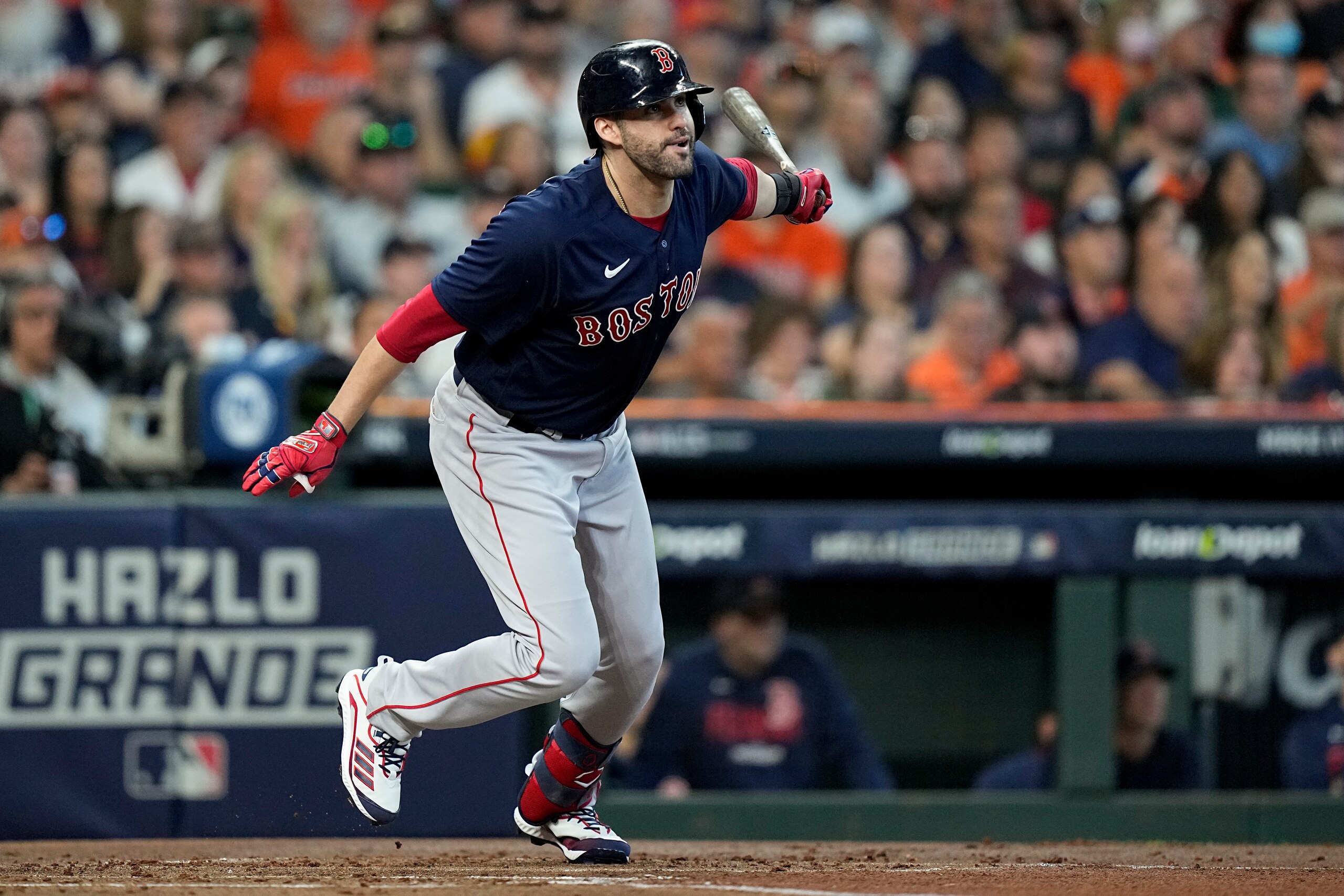 Boston Red Sox's J.D. Martinez watches his grand slam against the Houston Astros during the first inning in Game 2 of baseball's American League Championship Series Saturday, Oct. 16, 2021, in Houston. (AP Photo/David J. Phillip)