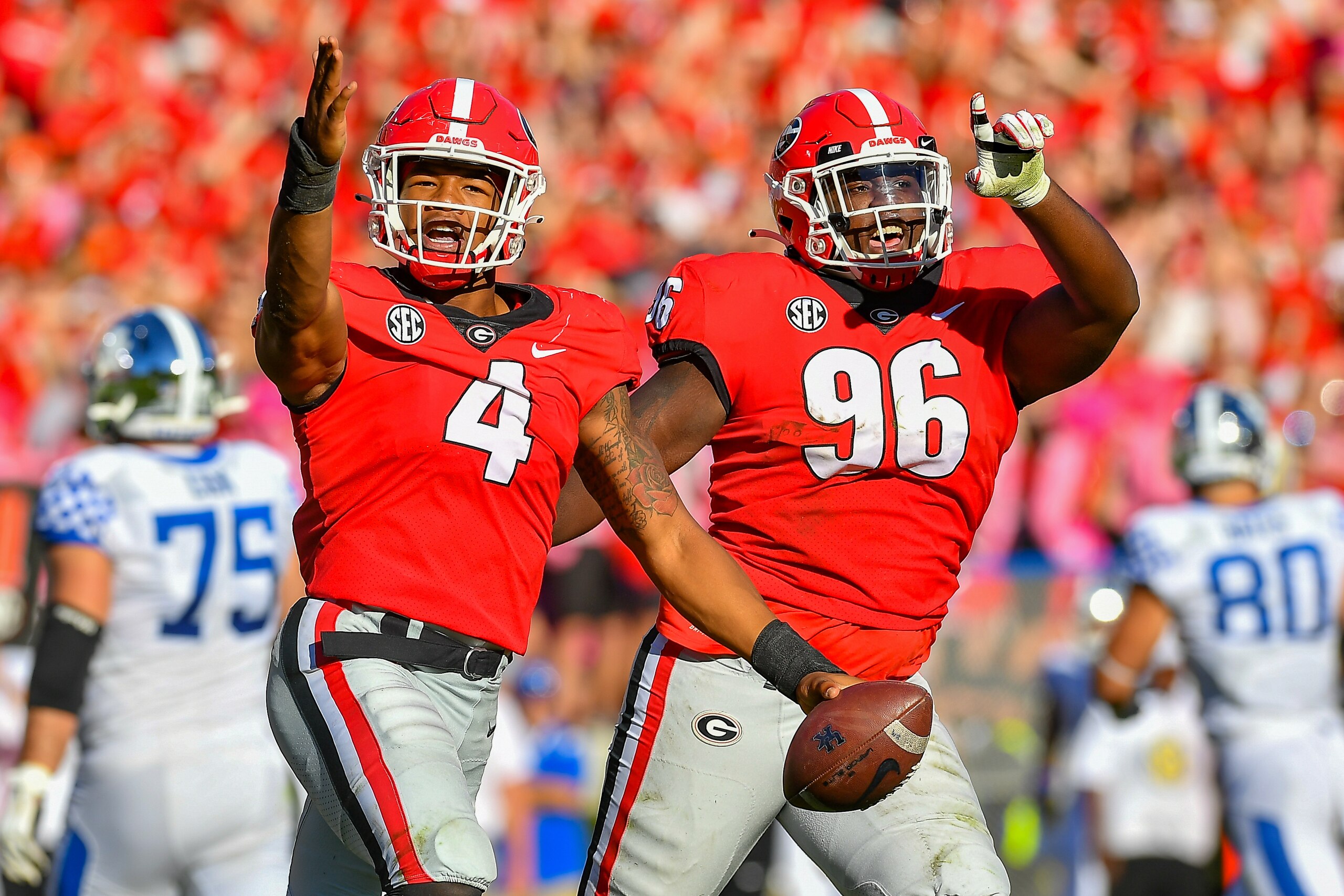 ATHENS, GA OCTOBER 16: Georgia linebacker Nolan Smith (4) and defensive lineman Zion Logue (96) react after a defensive stop during the NCAA football game between the Kentucky Wildcats and the Georgia Bulldogs on October 16th, 2021 at Sanford Stadium in Athens, GA. (Photo by Rich von Biberstein/Icon Sportswire via Getty Images) ATHENS, GA OCTOBER 16: Georgia linebacker Nolan Smith (4) and defensive lineman Zion Logue (96) react after a defensive stop during the NCAA football game between the Kentucky Wildcats and the Georgia Bulldogs on October 16th, 2021 at Sanford Stadium in Athens, GA. (Photo by Rich von Biberstein/Icon Sportswire via Getty Images)