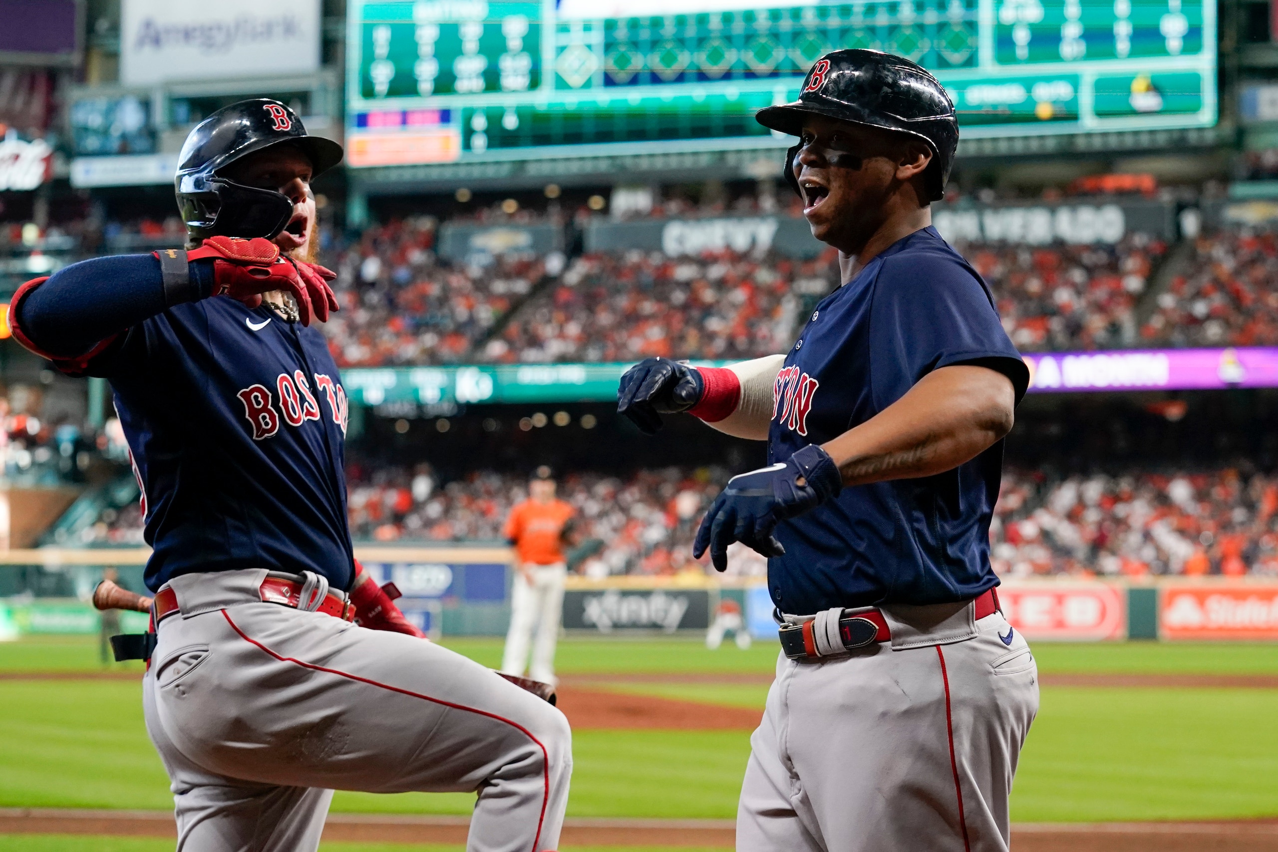 Boston Red Sox's Rafael Devers celebrates a grand slam home run against the Houston Astros during the second inning in Game 2 of baseball's American League Championship Series Saturday, Oct. 16, 2021, in Houston. (AP Photo/Tony Gutierrez)