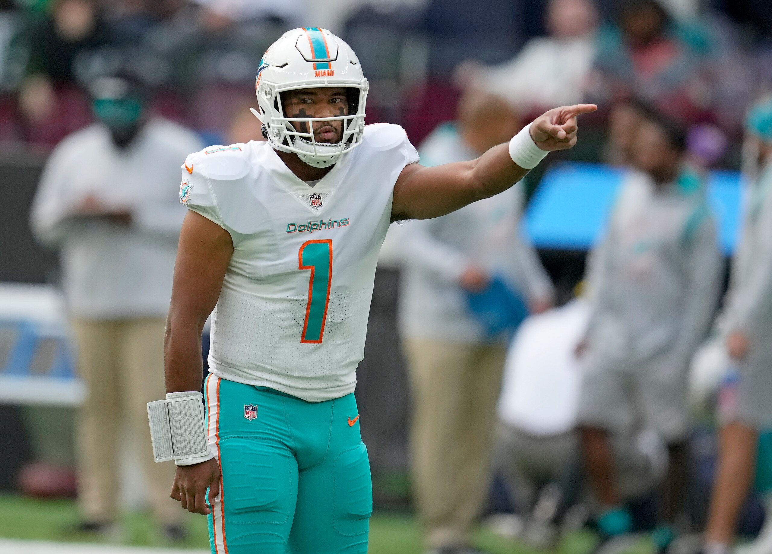 Miami Dolphins quarterback Tua Tagovailoa (1) gestures during the first half of an NFL football game between the Miami Dolphins and the Jacksonville Jaguars at the Tottenham Hotspur stadium in London, England, Sunday, Oct. 17, 2021. (AP Photo/Matt Dunhan)
