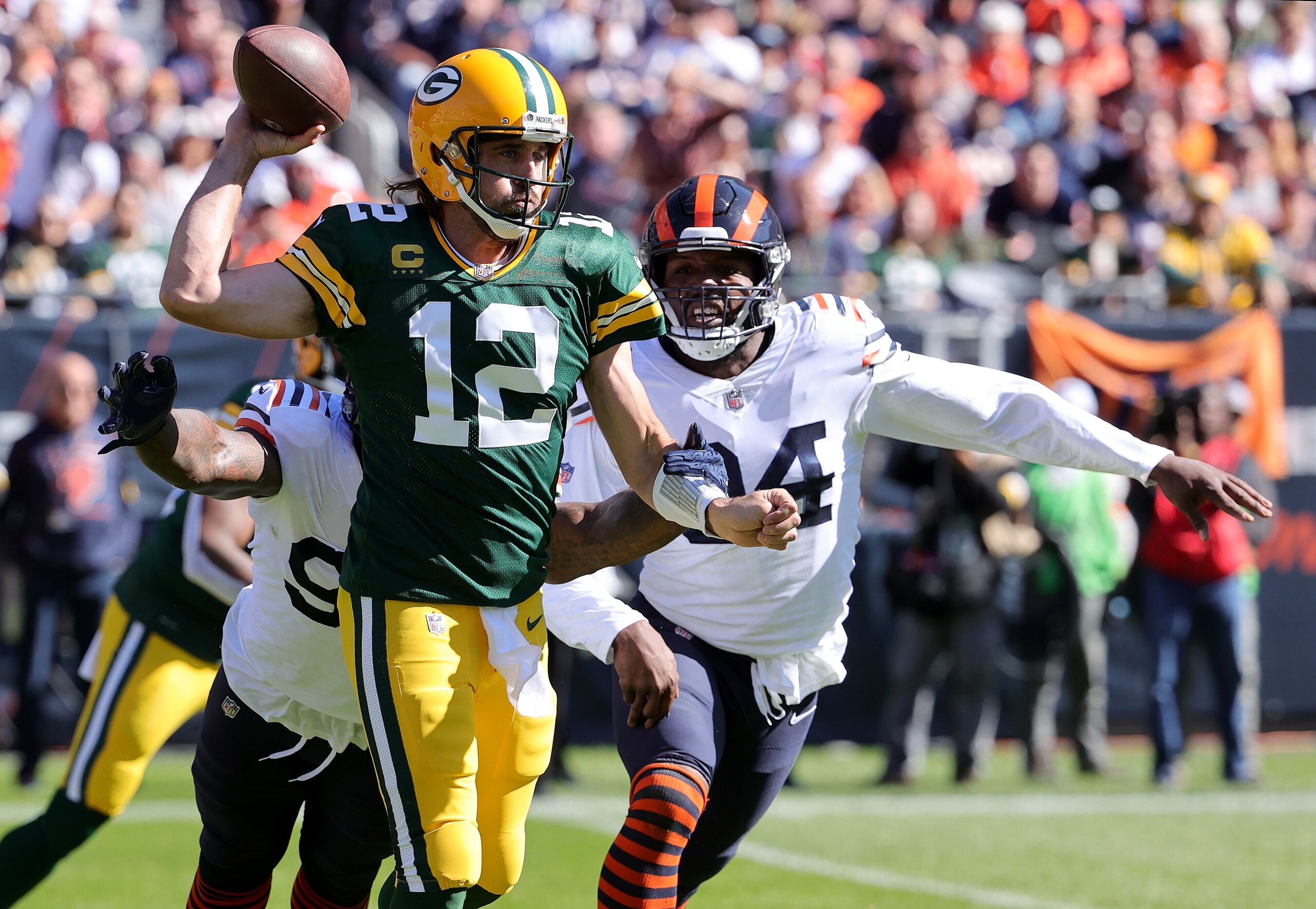 CHICAGO, ILLINOIS - OCTOBER 17: Aaron Rodgers #12 of the Green Bay Packers looks to pass against the Chicago Bears in the first half at Soldier Field on October 17, 2021 in Chicago, Illinois. (Photo by Jonathan Daniel/Getty Images) CHICAGO, ILLINOIS - OCTOBER 17: Aaron Rodgers #12 of the Green Bay Packers looks to pass against the Chicago Bears in the first half at Soldier Field on October 17, 2021 in Chicago, Illinois. (Photo by Jonathan Daniel/Getty Images)