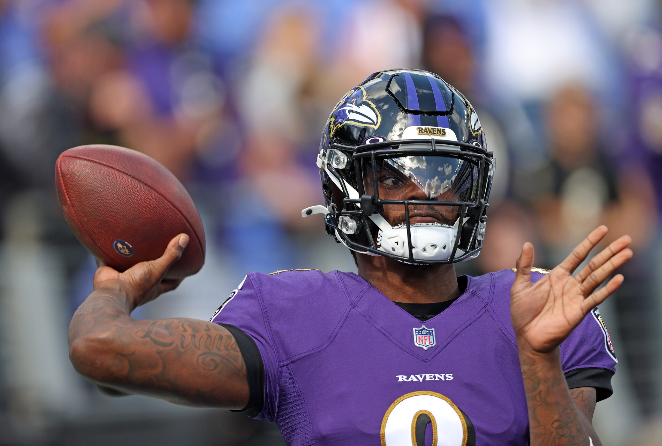 BALTIMORE, MARYLAND - OCTOBER 17: Lamar Jackson #8 of the Baltimore Ravens warms up prior to the game against the Los Angeles Chargers at M&T Bank Stadium on October 17, 2021 in Baltimore, Maryland. (Photo by Patrick Smith/Getty Images)