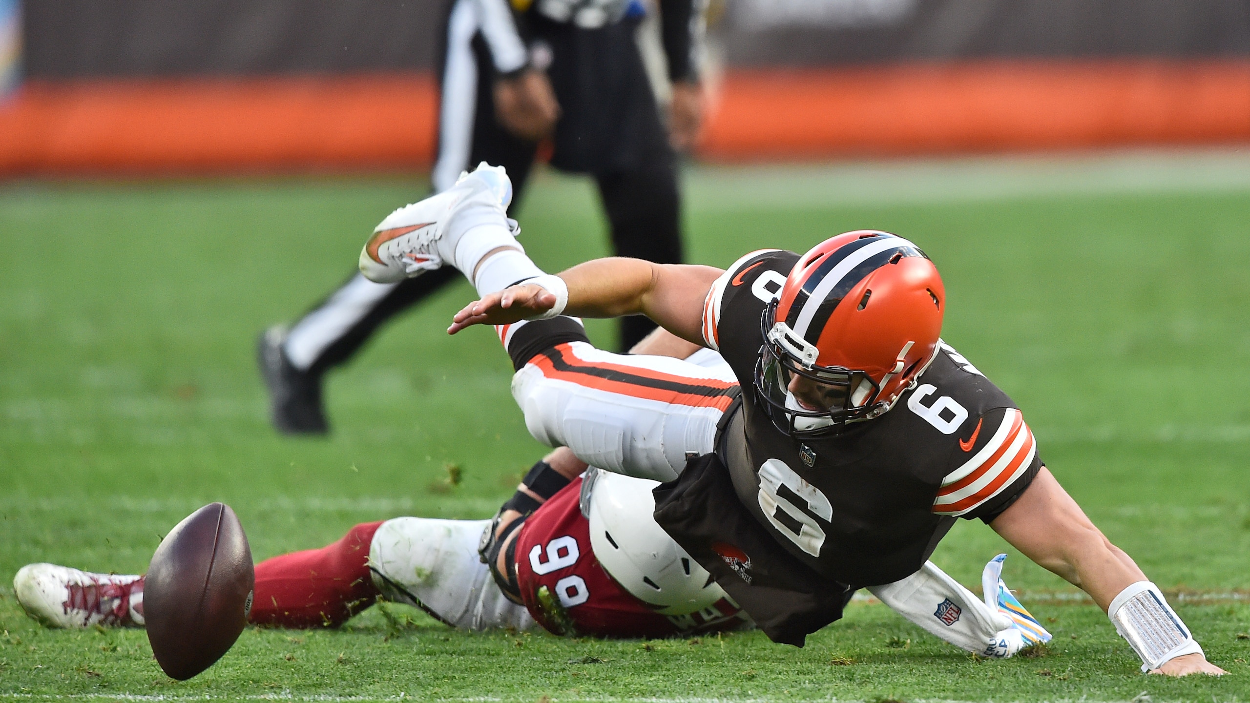 Cleveland Browns quarterback Baker Mayfield (6) fumbles and is injured on a play during the second half of an NFL football game against the Arizona Cardinals, Sunday, Oct. 17, 2021, in Cleveland. (AP Photo/David Richard) Cleveland Browns quarterback Baker Mayfield (6) fumbles and is injured on a play during the second half of an NFL football game against the Arizona Cardinals, Sunday, Oct. 17, 2021, in Cleveland. (AP Photo/David Richard)
