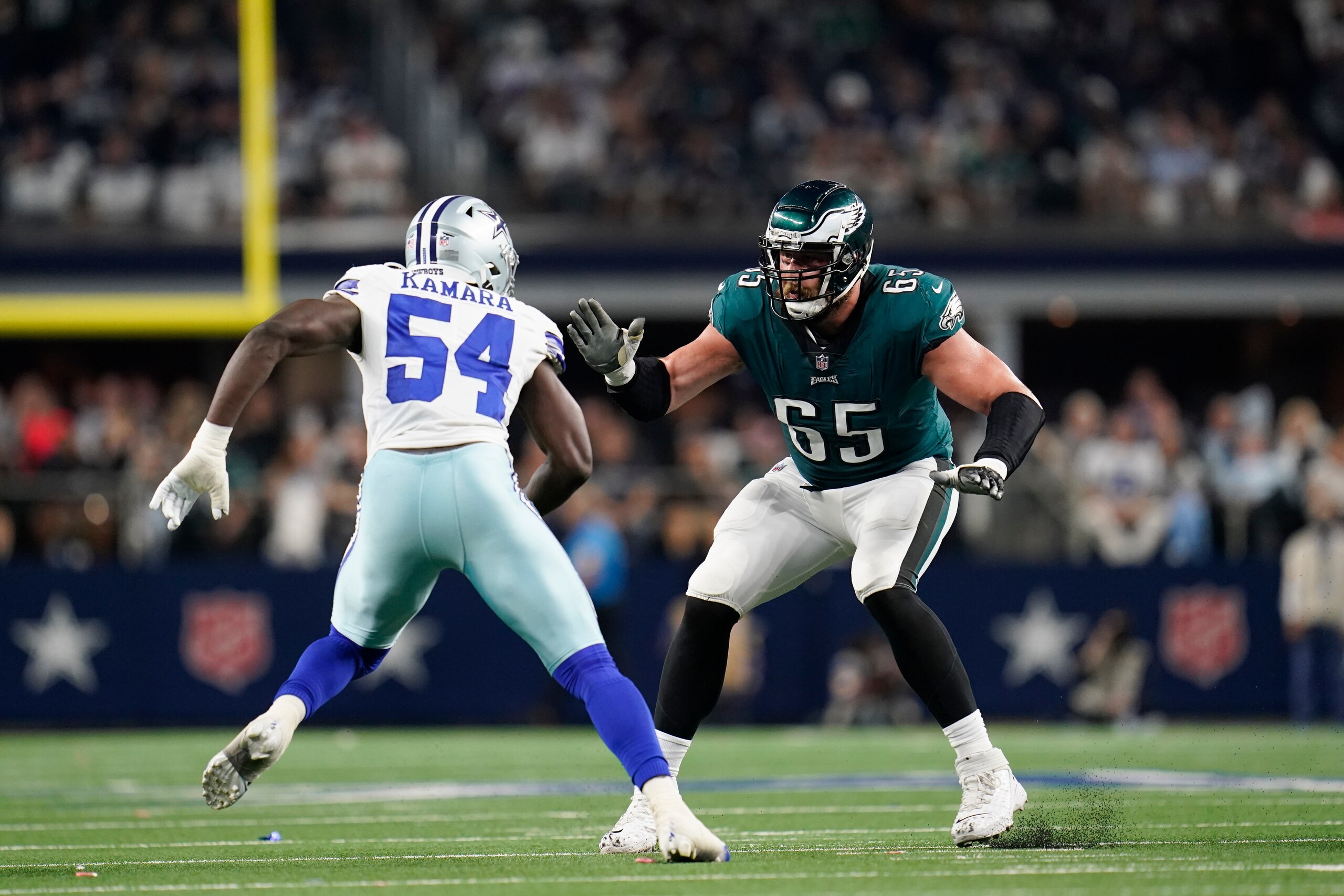 Philadelphia Eagles offensive lineman Lane Johnson (65) looks to block against Azur Kamara (54) during an NFL football game against the Dallas Cowboys, Monday, Sept. 27, 2021, in Arlington, Texas. (AP Photo/Matt Patterson)