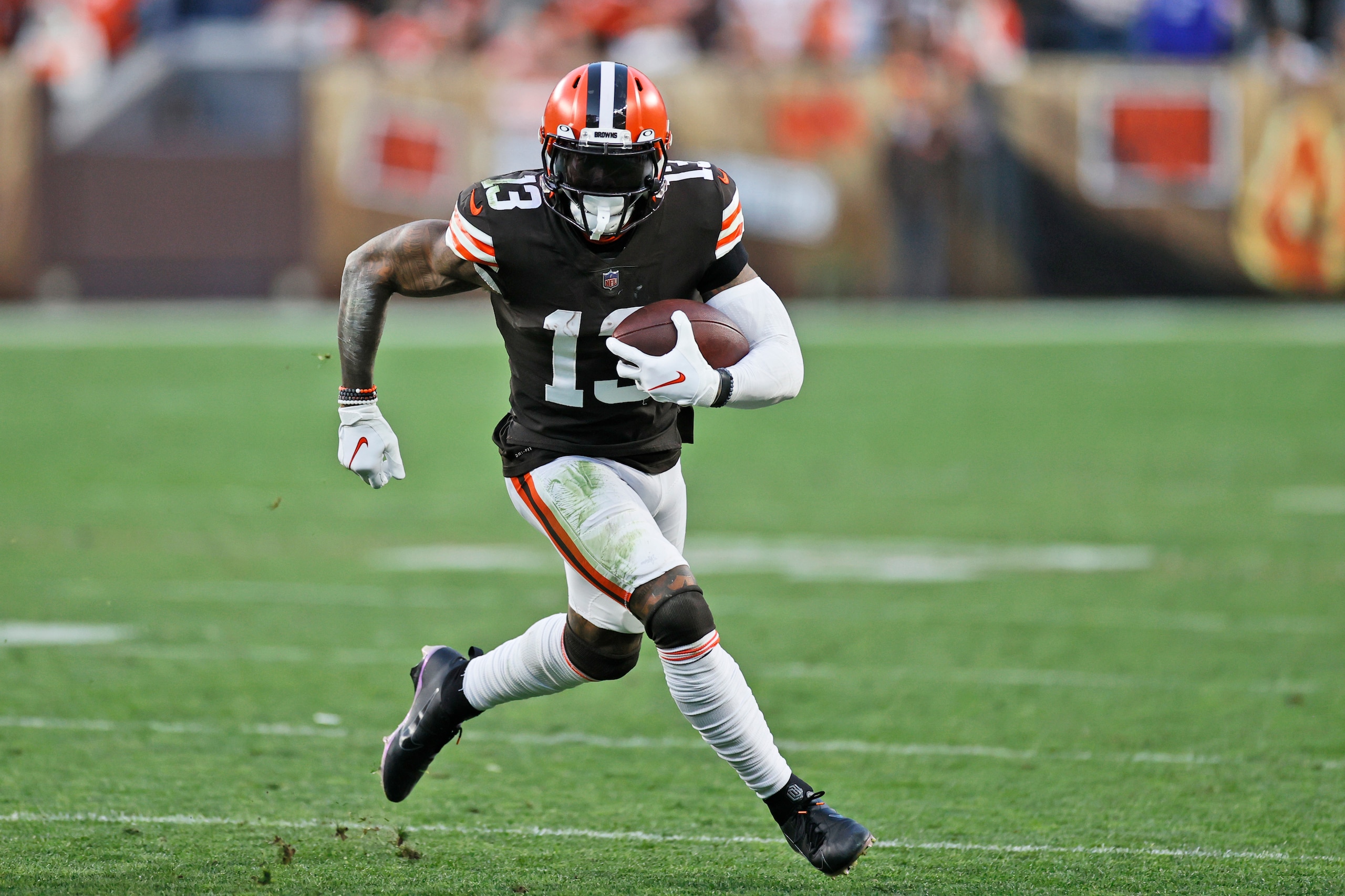 Cleveland Browns wide receiver Odell Beckham Jr. runs with the ball during the second half of an NFL football game against the Arizona Cardinals, Sunday, Oct. 17, 2021, in Cleveland. (AP Photo/Ron Schwane)