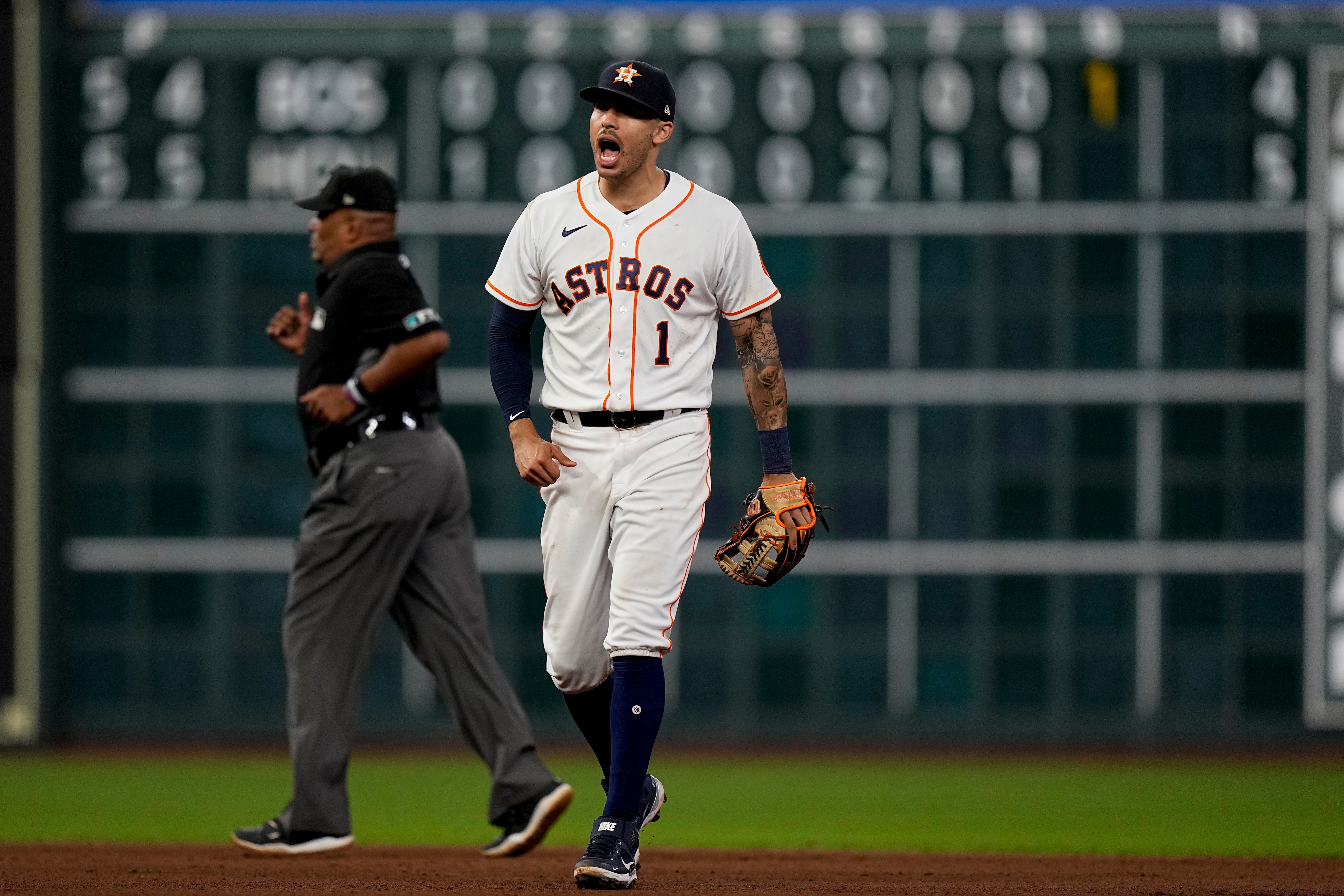 Houston Astros shortstop Carlos Correa celebrates their win against the Boston Red Sox in Game 1 of baseball's American League Championship Series Friday, Oct. 15, 2021, in Houston. (AP Photo/David J. Phillip)