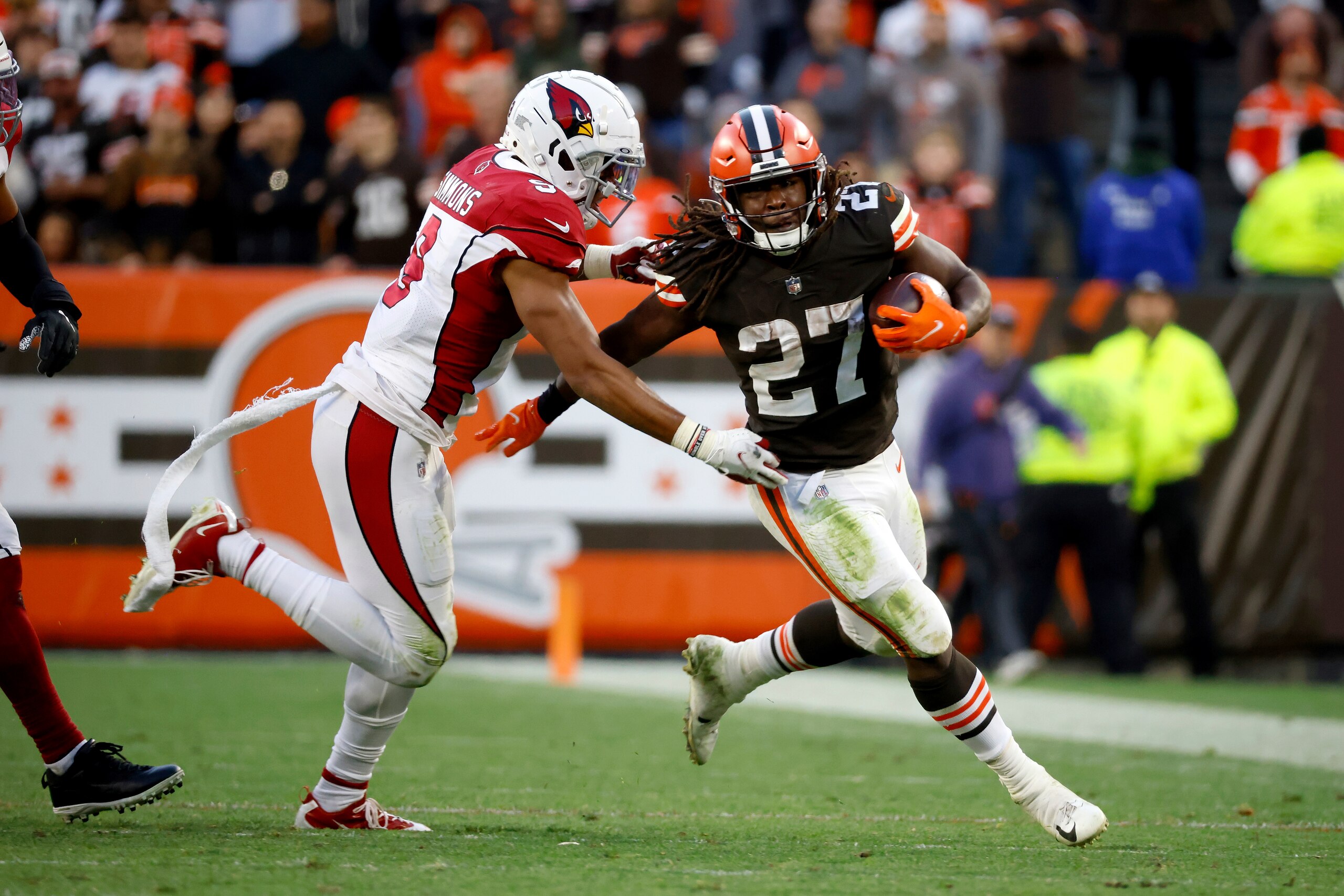 Arizona Cardinals linebacker Isaiah Simmons (9) tackles Cleveland Browns running back Kareem Hunt (27) during an NFL football game, Sunday, Oct. 17, 2021, in Cleveland. (AP Photo/Kirk Irwin)