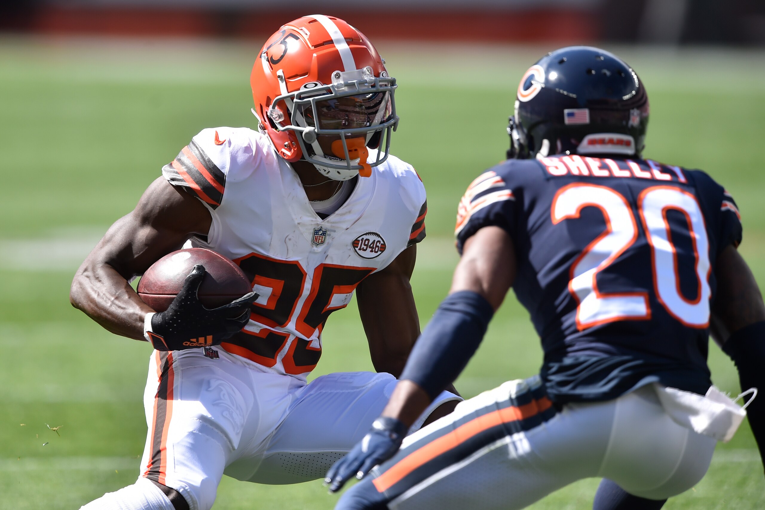 Cleveland Browns running back Demetric Felton, left, runs against Chicago Bears cornerback Duke Shelley after a catch during the first half of an NFL football game, Sunday, Sept. 26, 2021, in Cleveland. (AP Photo/David Richard)