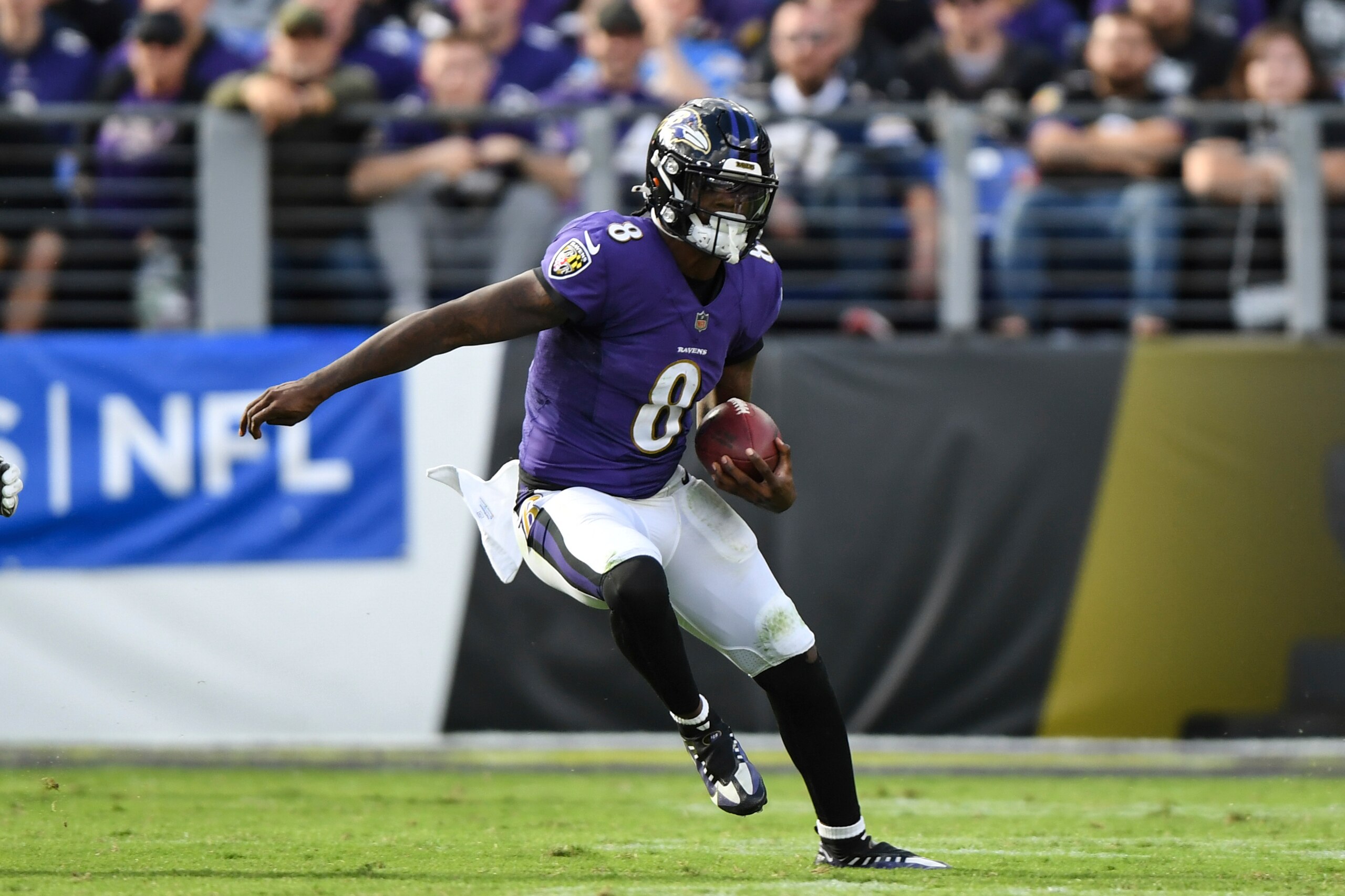 Baltimore Ravens quarterback Lamar Jackson (8) runs the ball during the fourth quarter of an NFL football game against the Los Angeles Chargers, Sunday, Oct. 17, 2021, in Baltimore, Md. (AP Photo/Terrance Williams)