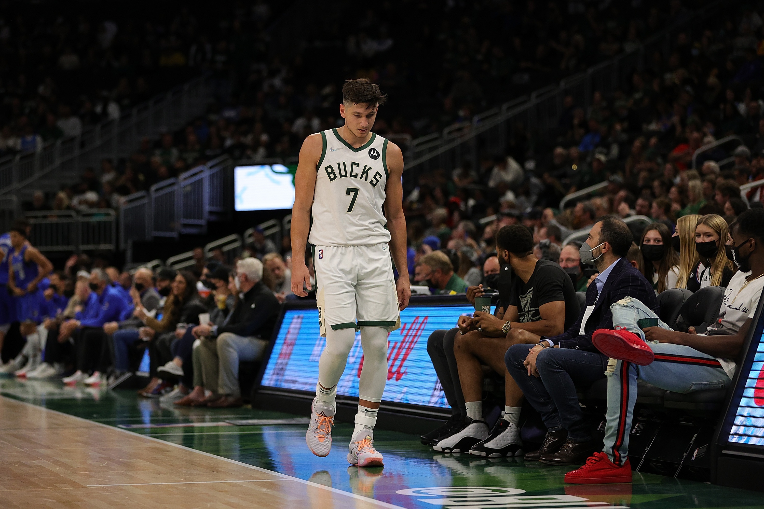 MILWAUKEE, WISCONSIN - OCTOBER 15: Grayson Allen #7 of the Milwaukee Bucks walks to the bench during the second half of a game against the Dallas Mavericks at Fiserv Forum on October 15, 2021 in Milwaukee, Wisconsin. NOTE TO USER: User expressly acknowledges and agrees that, by downloading and or using this photograph, User is consenting to the terms and conditions of the Getty Images License Agreement. (Photo by Stacy Revere/Getty Images)