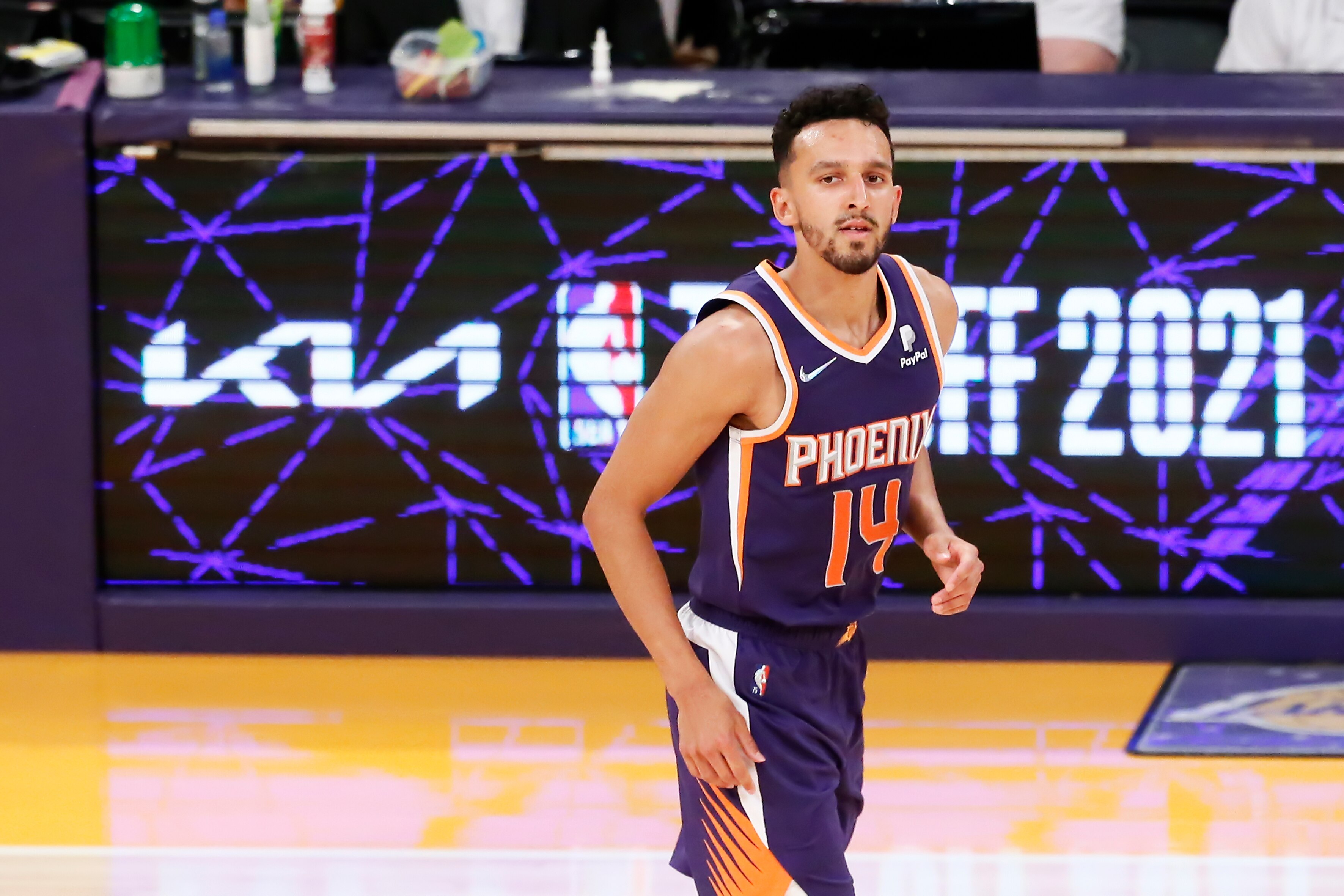 LOS ANGELES, CA - OCT 10: Landry Shamet #14 of the Phoenix Suns looks on during a preseason game against the Los Angeles Lakers on October 10, 2021 at STAPLES Center in Los Angeles, California. NOTE TO USER: User expressly acknowledges and agrees that, by downloading and/or using this Photograph, user is consenting to the terms and conditions of the Getty Images License Agreement. Mandatory Copyright Notice: Copyright 2021 NBAE  (Photo by Chris Elise/NBAE via Getty Images)