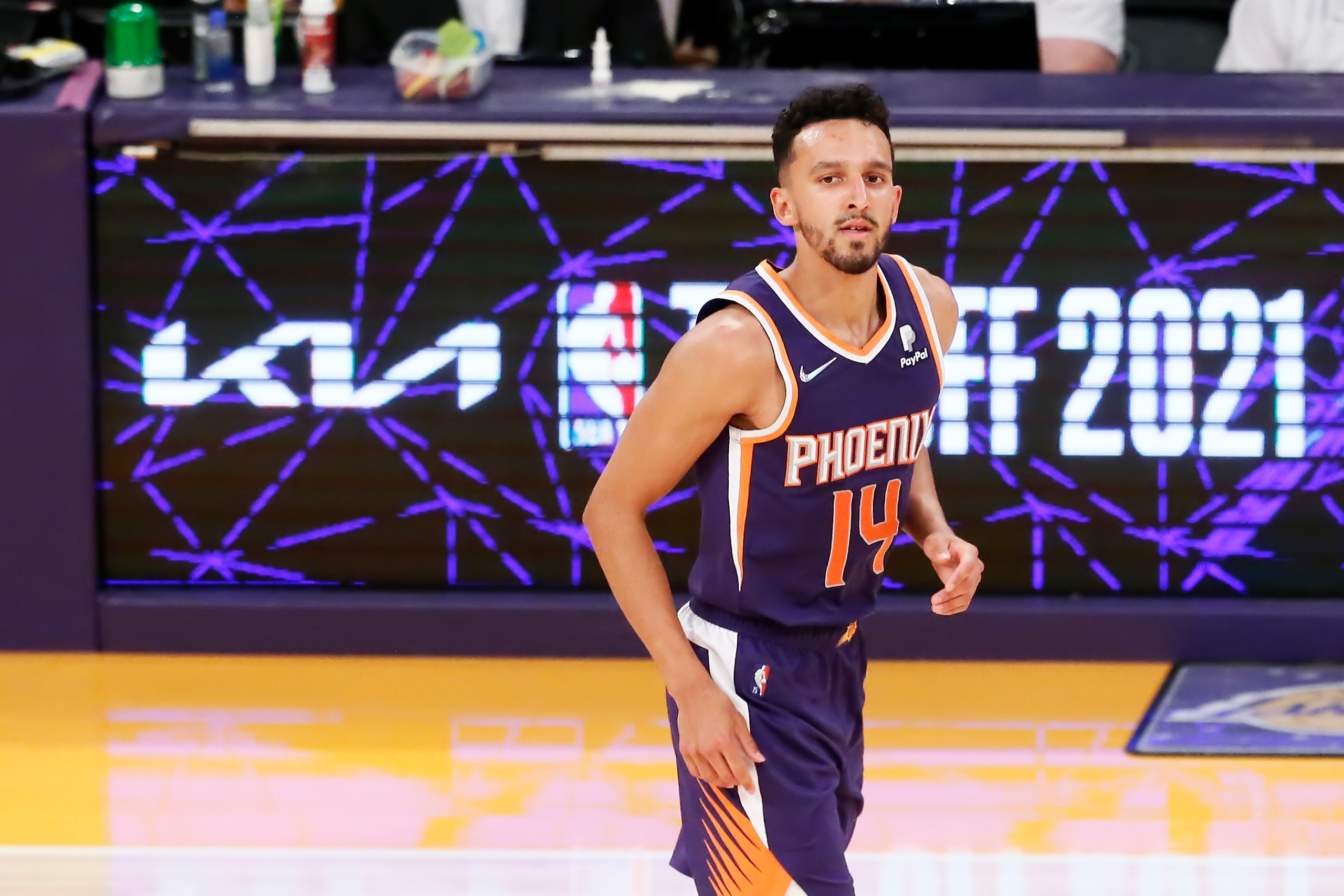 LOS ANGELES, CA - OCT 10: Landry Shamet #14 of the Phoenix Suns looks on during a preseason game against the Los Angeles Lakers on October 10, 2021 at STAPLES Center in Los Angeles, California. NOTE TO USER: User expressly acknowledges and agrees that, by downloading and/or using this Photograph, user is consenting to the terms and conditions of the Getty Images License Agreement. Mandatory Copyright Notice: Copyright 2021 NBAE  (Photo by Chris Elise/NBAE via Getty Images)