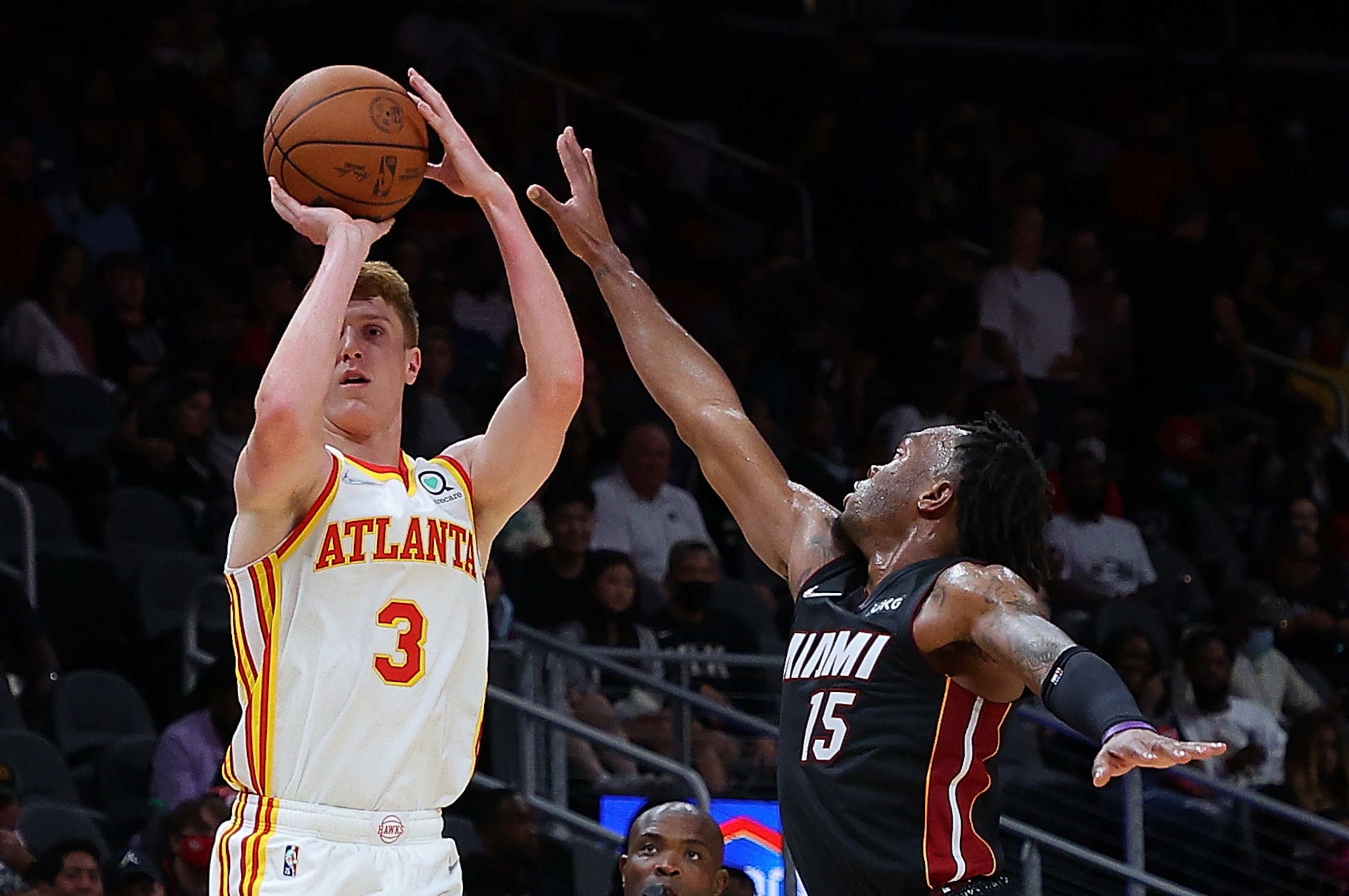 ATLANTA, GEORGIA - OCTOBER 14:  Kevin Huerter #3 of the Atlanta Hawks shoots a three-point basket against Javonte Smart #15 of the Miami Heat during the second half at State Farm Arena on October 14, 2021 in Atlanta, Georgia.  NOTE TO USER: User expressly acknowledges and agrees that, by downloading and or using this photograph, User is consenting to the terms and conditions of the Getty Images License Agreement.  (Photo by Kevin C. Cox/Getty Images)