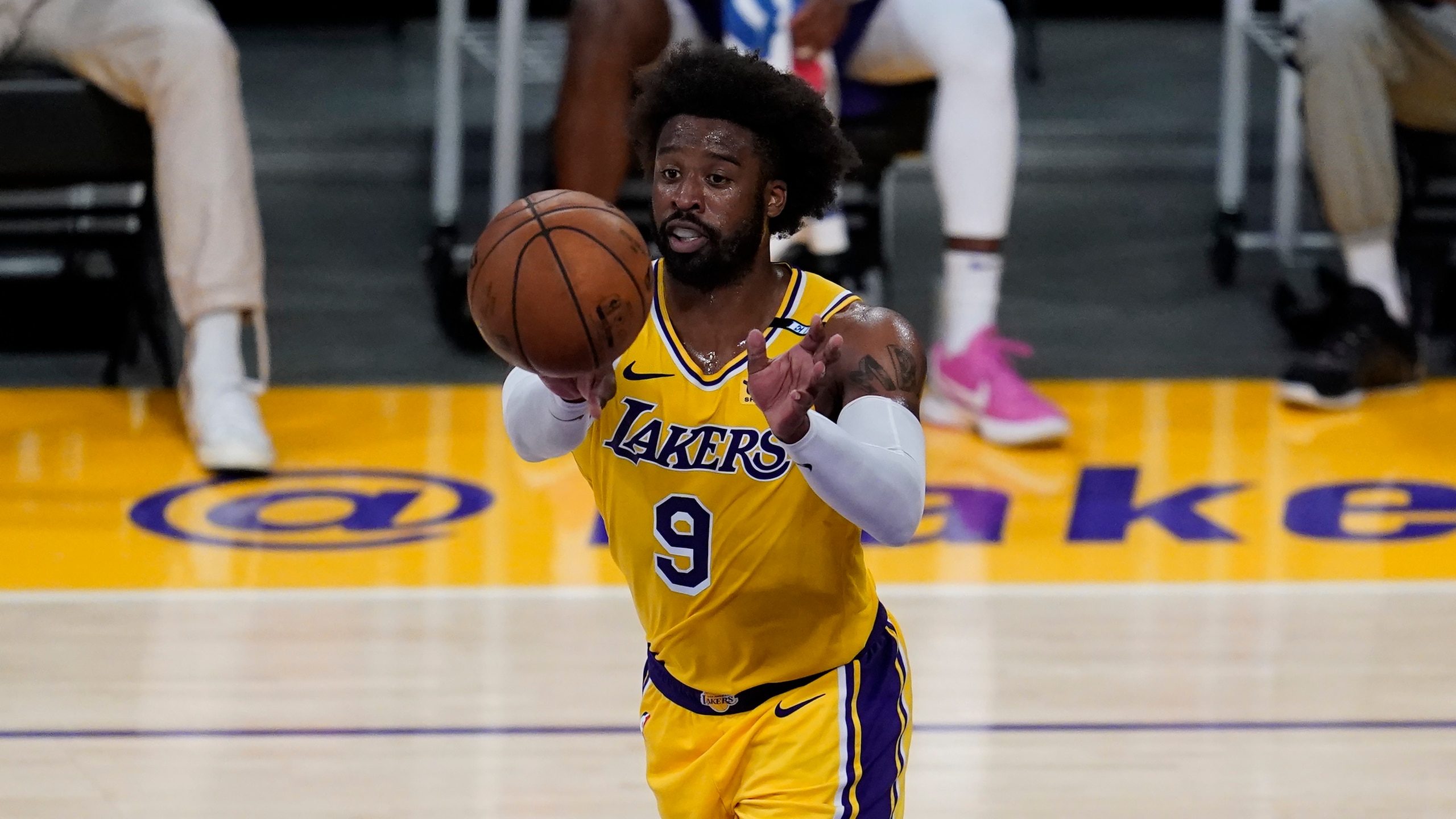 Los Angeles Lakers guard Wesley Matthews (9) passes the ball during Game 6 of an NBA basketball first-round playoff series against the Phoenix Suns Thursday, Jun 3, 2021, in Los Angeles. (AP Photo/Ashley Landis)