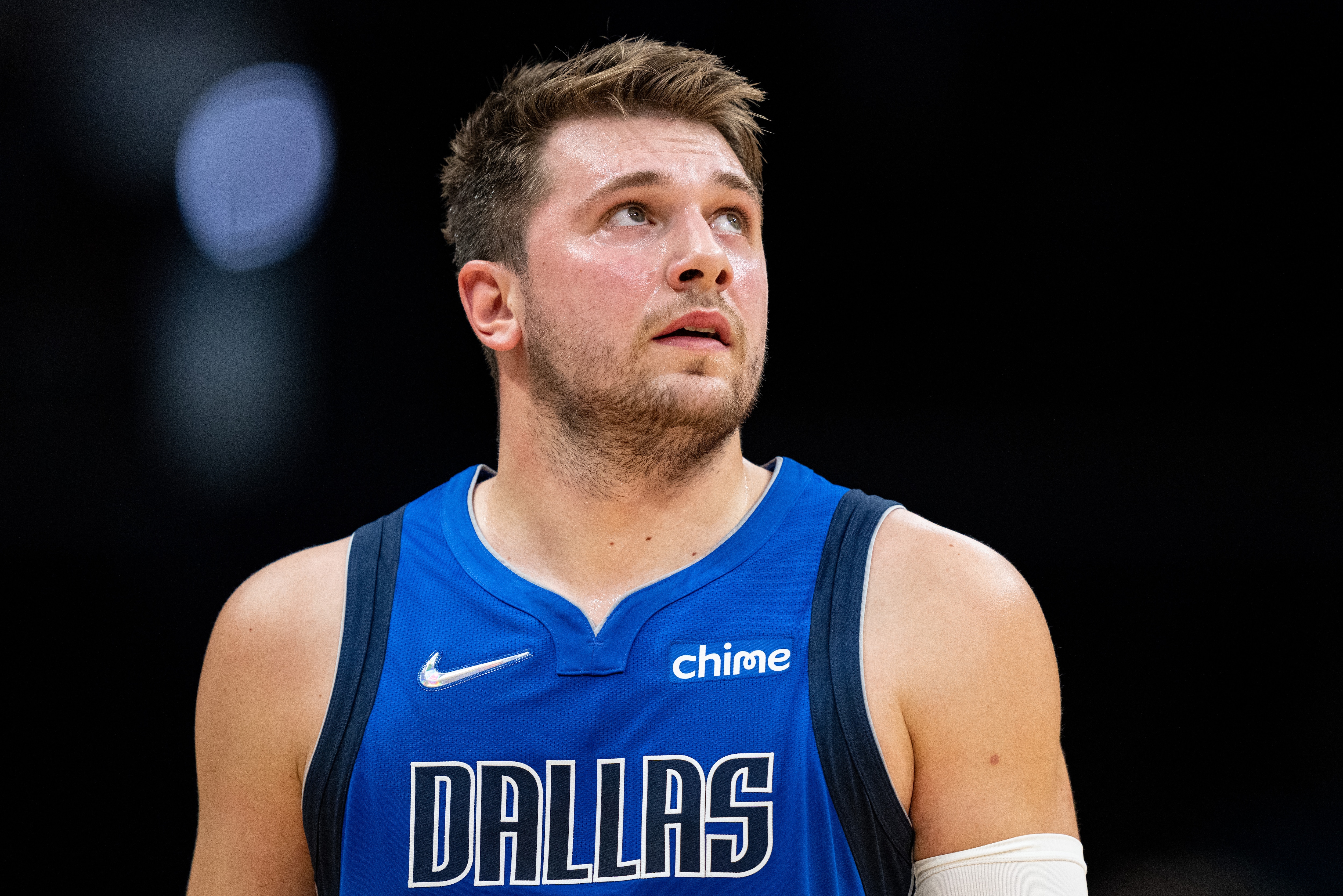 CHARLOTTE, NORTH CAROLINA - OCTOBER 13: Luka Doncic #77 of the Dallas Mavericks looks on during their game against the Charlotte Hornets at Spectrum Center on October 13, 2021 in Charlotte, North Carolina. NOTE TO USER: User expressly acknowledges and agrees that, by downloading and or using this photograph, User is consenting to the terms and conditions of the Getty Images License Agreement. (Photo by Jacob Kupferman/Getty Images)