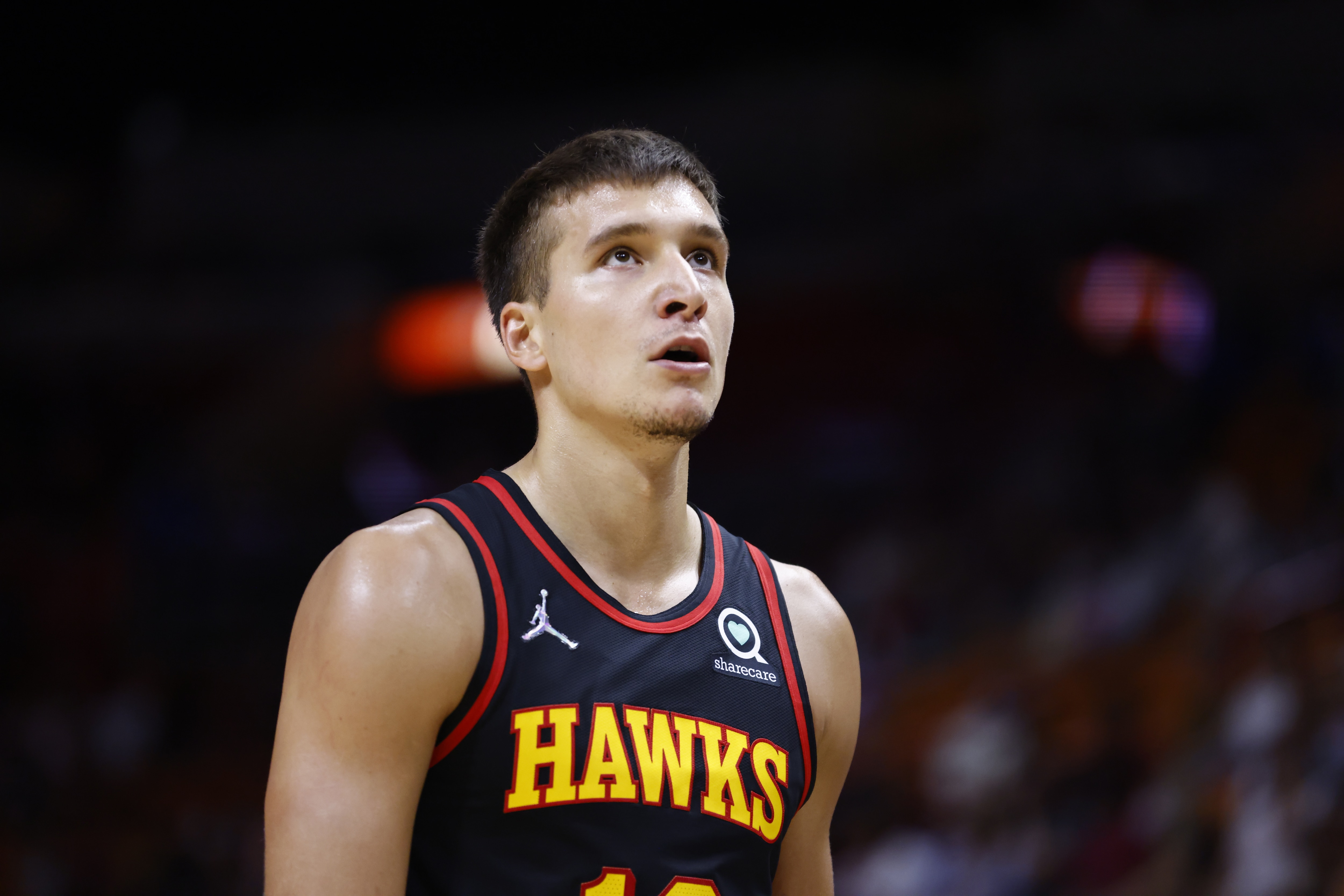 MIAMI, FL - OCTOBER 4: Bogdan Bogdanovic #13 of the Atlanta Hawks looks on during a preseason game against the Miami Heat on October 4, 2021 at FTX Arena in Miami, Florida. NOTE TO USER: User expressly acknowledges and agrees that, by downloading and or using this Photograph, user is consenting to the terms and conditions of the Getty Images License Agreement. Mandatory Copyright Notice: Copyright 2021 NBAE (Photo by Michael Reaves/NBAE via Getty Images)