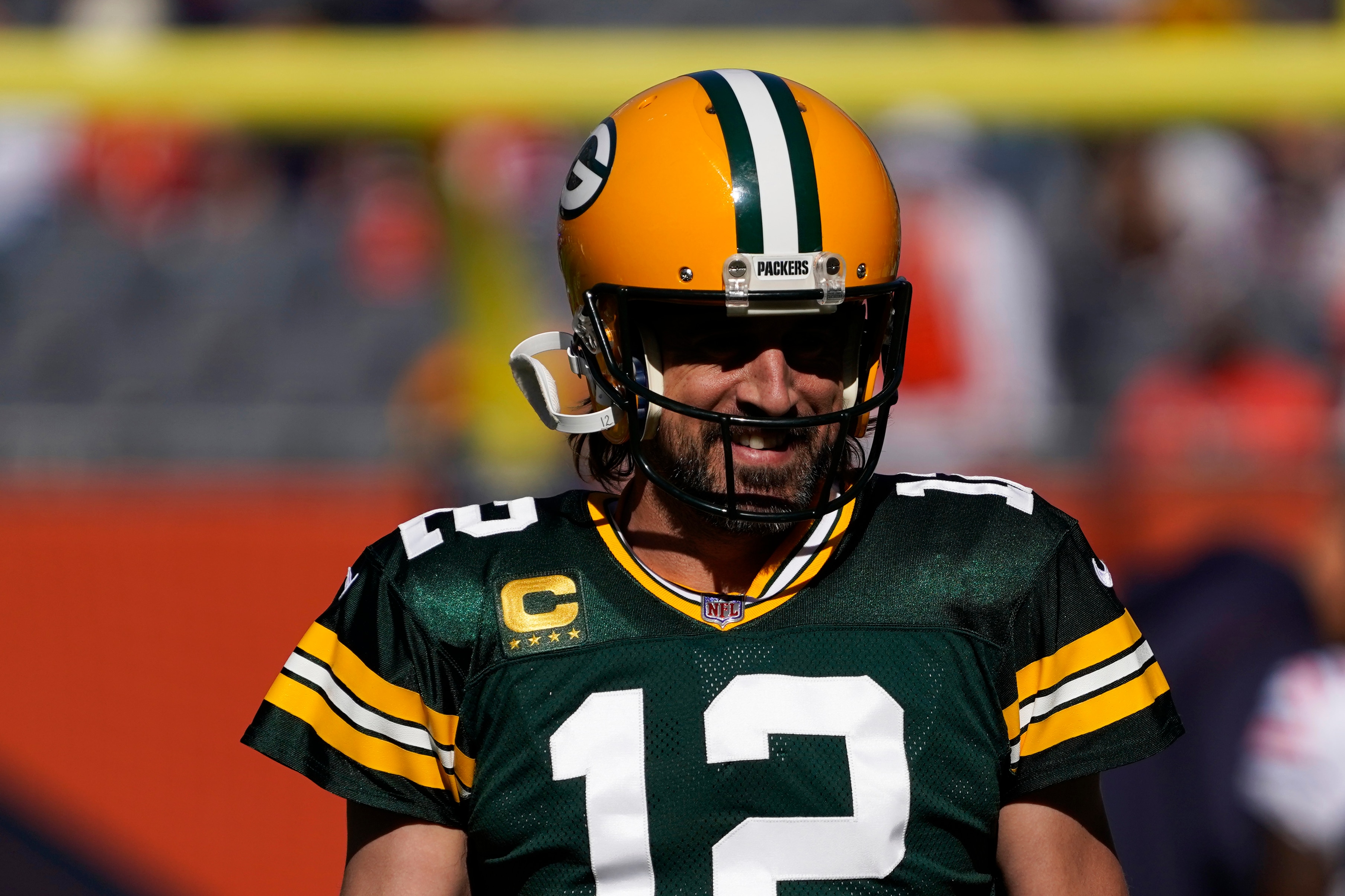 Green Bay Packers quarterback Aaron Rodgers (12) warms up during an NFL football game in Chicago, Sunday, Oct. 17, 2021. (AP Photo/David Banks)