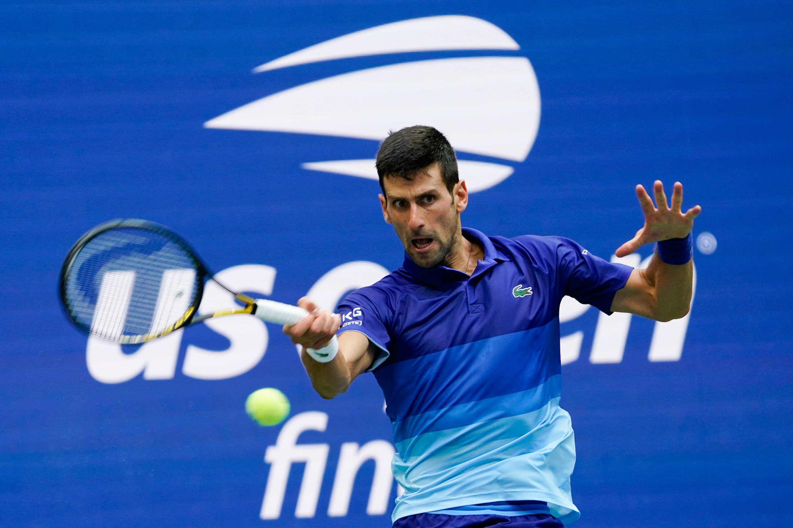 Novak Djokovic, of Serbia, returns to Daniil Medvedev, of Russia, during the men's singles final of the US Open tennis championships, Sunday, Sept. 12, 2021, in New York. (AP Photo/John Minchillo) Novak Djokovic, of Serbia, returns to Daniil Medvedev, of Russia, during the men's singles final of the US Open tennis championships, Sunday, Sept. 12, 2021, in New York. (AP Photo/John Minchillo)